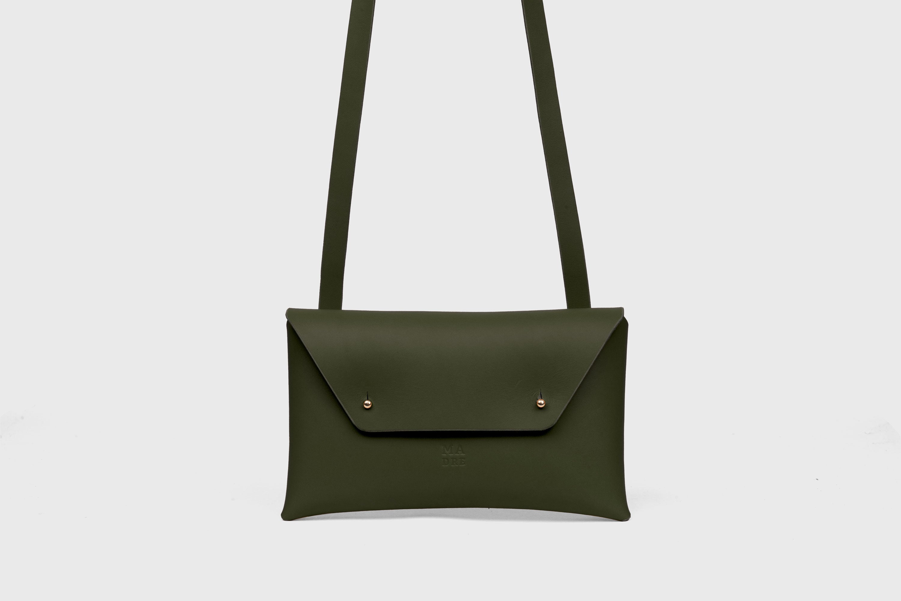 Envelope Bag With a Strap In Olive Green Color Vegetable Tanned Leather Minimalistic Design Atelier Madre Manuel Dreesmann Barcelona Spain