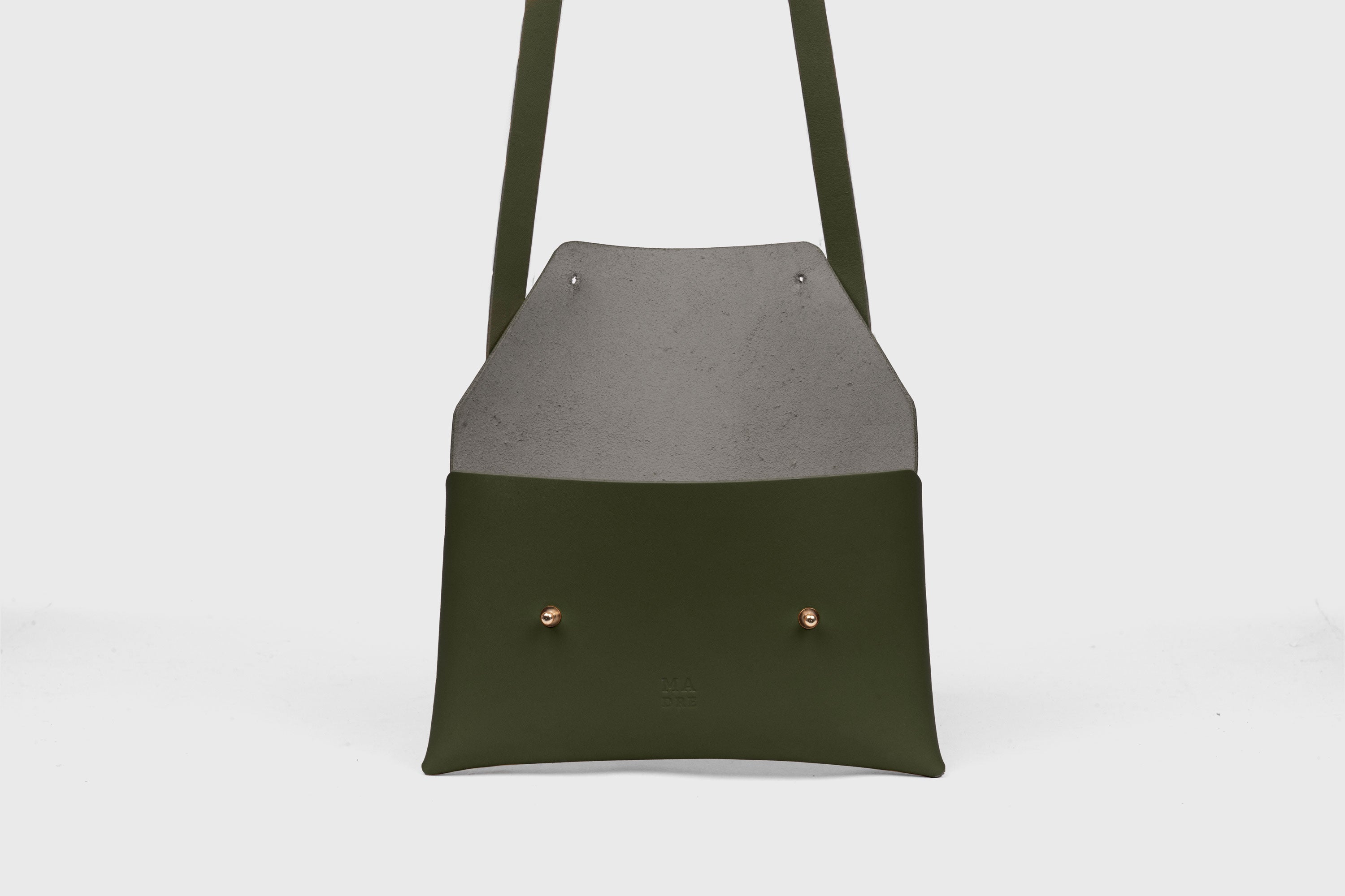 Envelope Bag With a Strap In Olive Green Color Vegetable Tanned Leather Minimalistic Design Atelier Madre Manuel Dreesmann Barcelona Spain