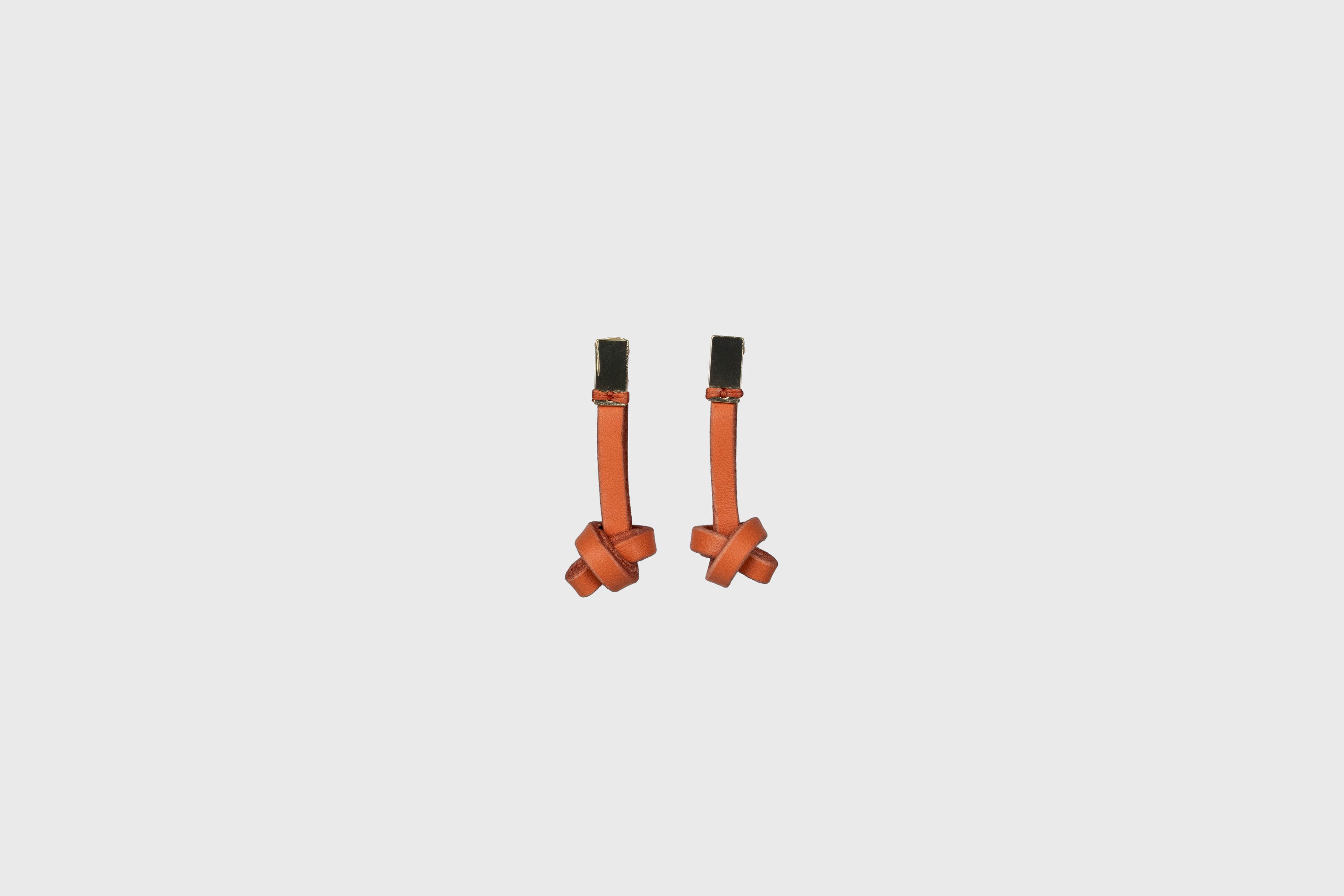 Gaia Earrings In Orange Color In Vegetable Tanned Leather Minimalistic Design Atelier Madre Manuel Dreesmann Barcelona Spain