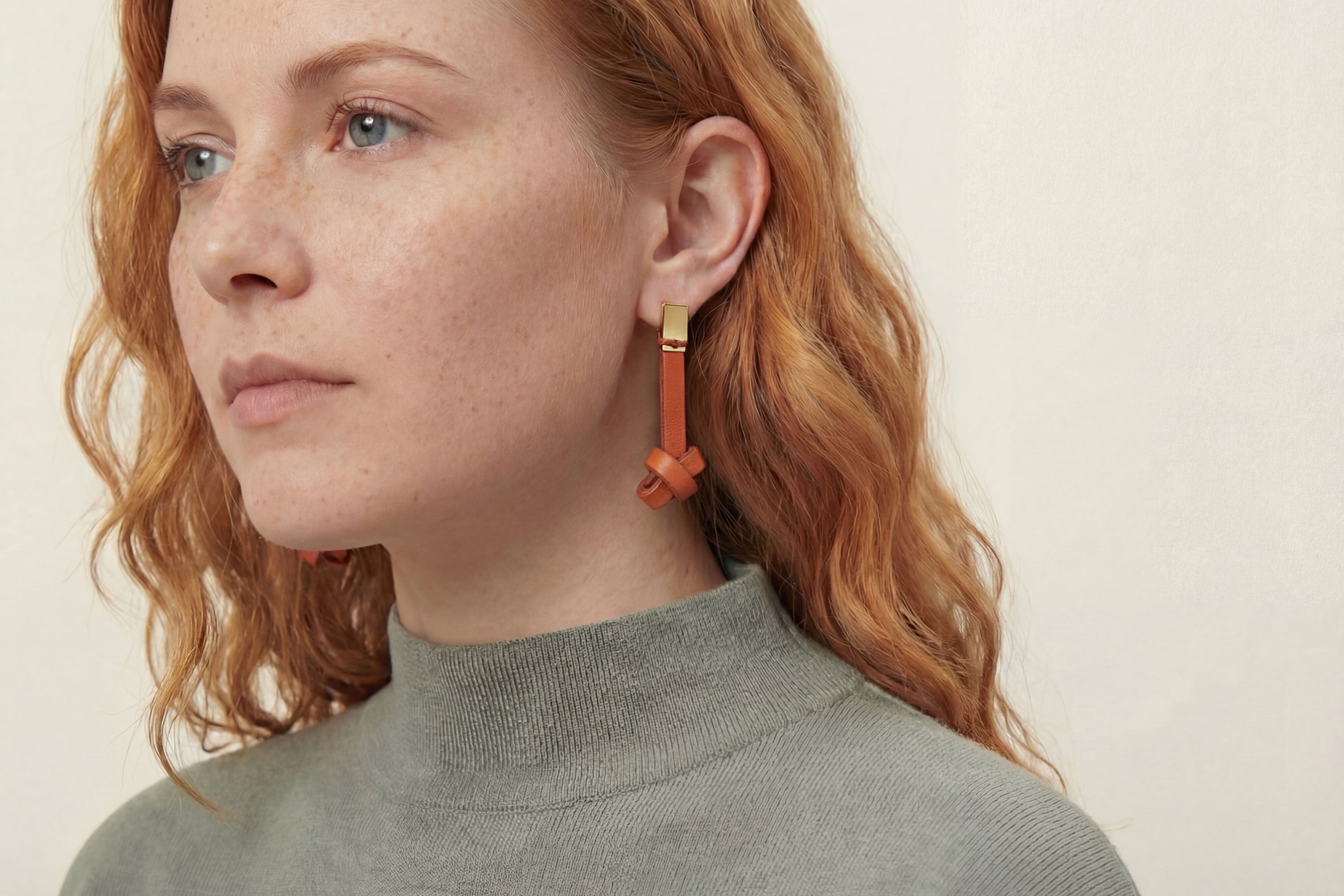 Gaia Earrings In Orange Color In Vegetable Tanned Leather Minimalistic Design Atelier Madre Manuel Dreesmann Barcelona Spain