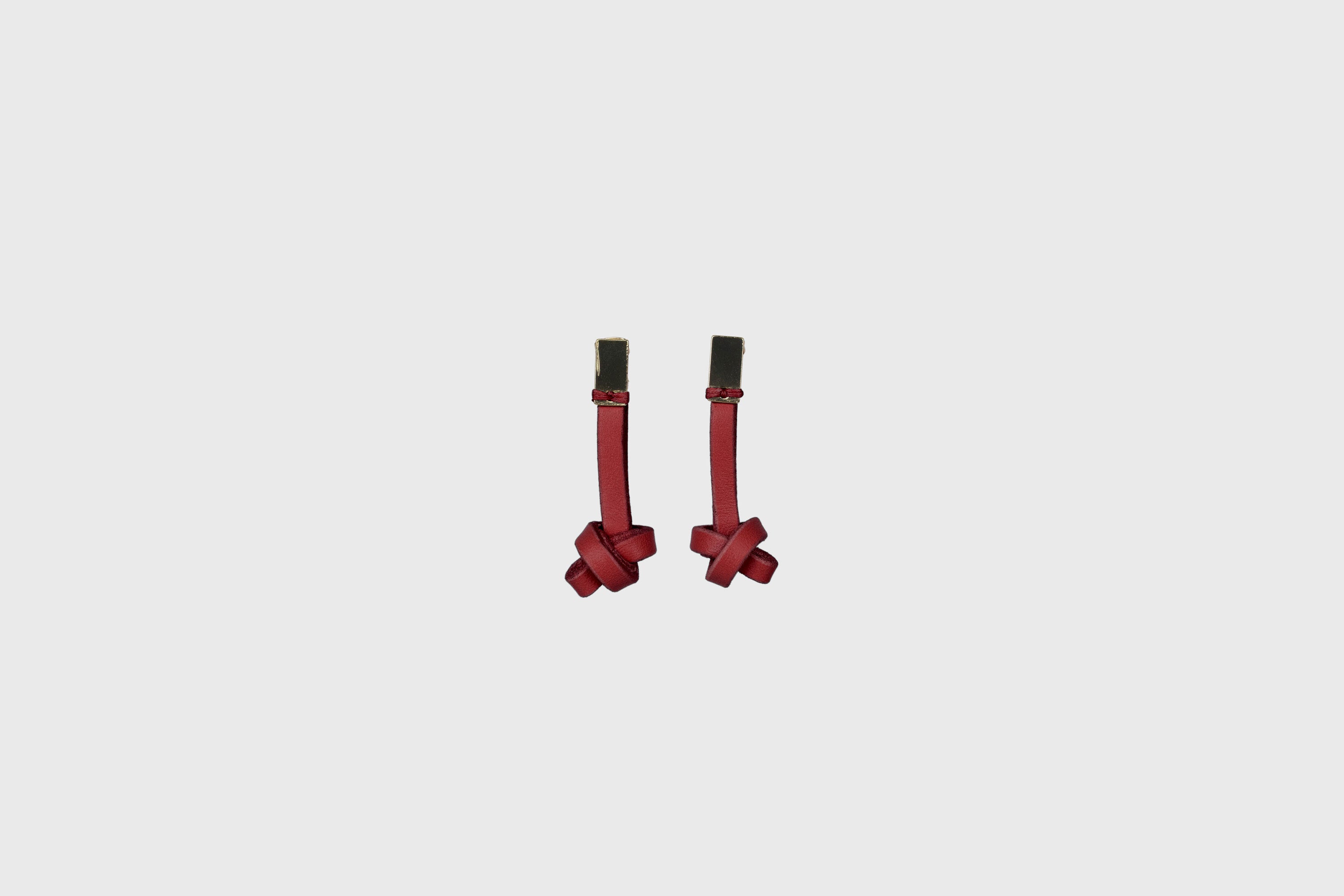 Gaia Earrings In Red Color In Vegetable Tanned Leather Minimalistic Design Atelier Madre Manuel Dreesmann Barcelona Spain