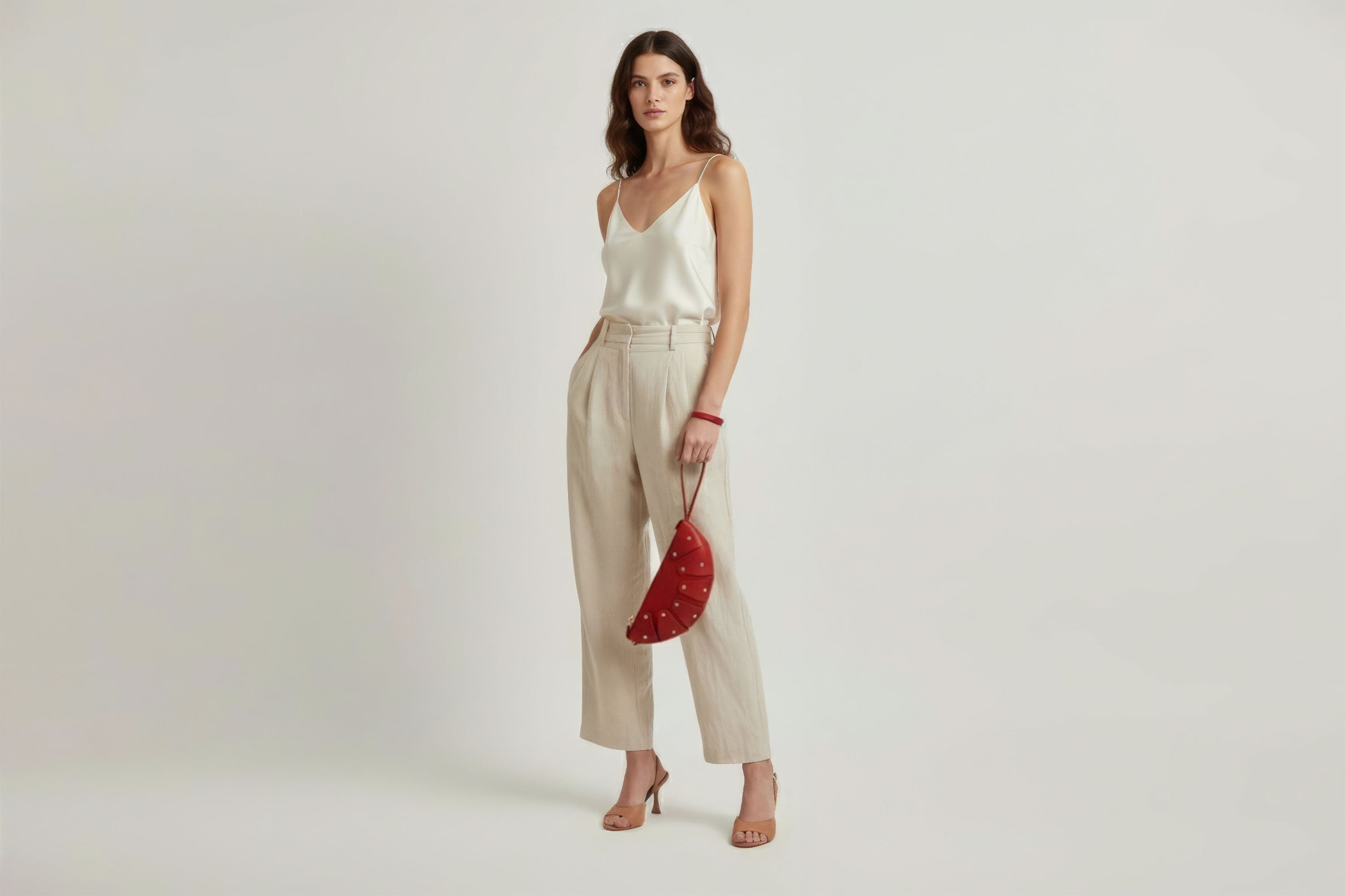 Juno Leather Bag Red Color On A Model Vegetable Tanned Full Grain Spain Brass Rivets Design Minimalist Half Moon Circle Round Zipper Pouch Handbag Clutch Bag Atelier Madre Manuel Dreesmann Barcelona