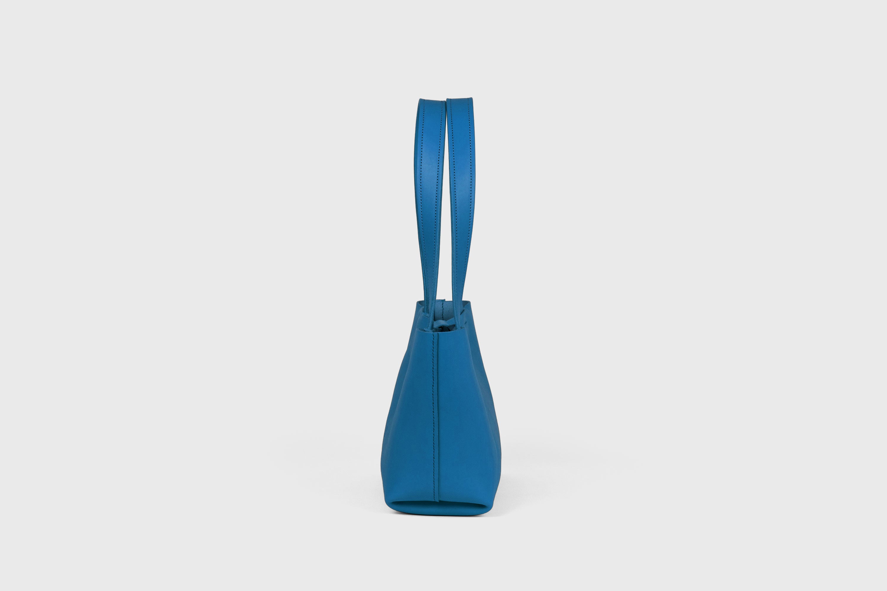 Karin Bag Closure In Royal Blue Color In Vegetable Tanned Leather Magnetic Closure Open Top Minimalistic Design Barcelona Spain