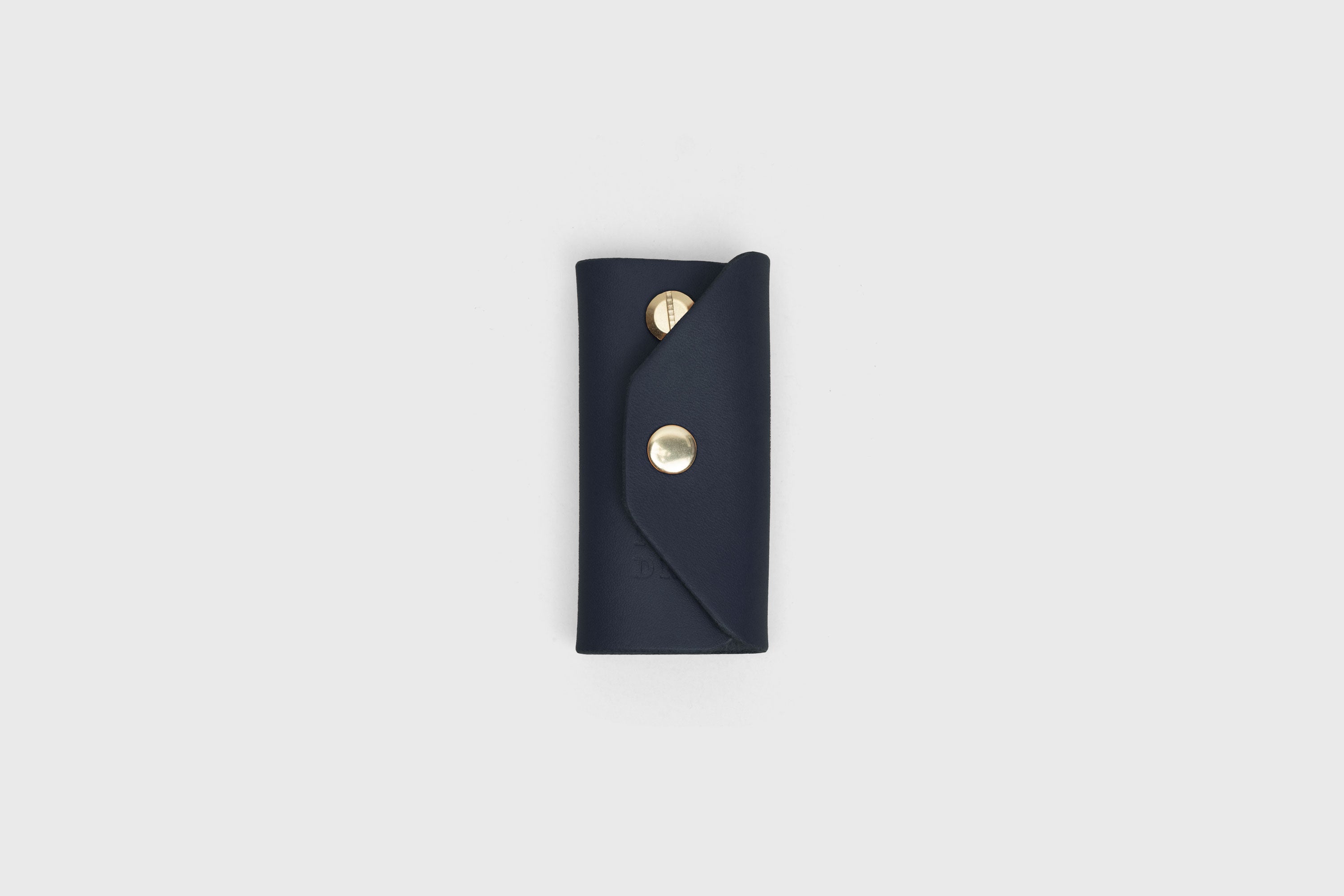 Key Etui In Marine Blue Color In Vegetable Tanned Leather Key Holder With Snap Button Minimalistic Design Atelier Madre Manuel Dreesmann Barcelona Spain