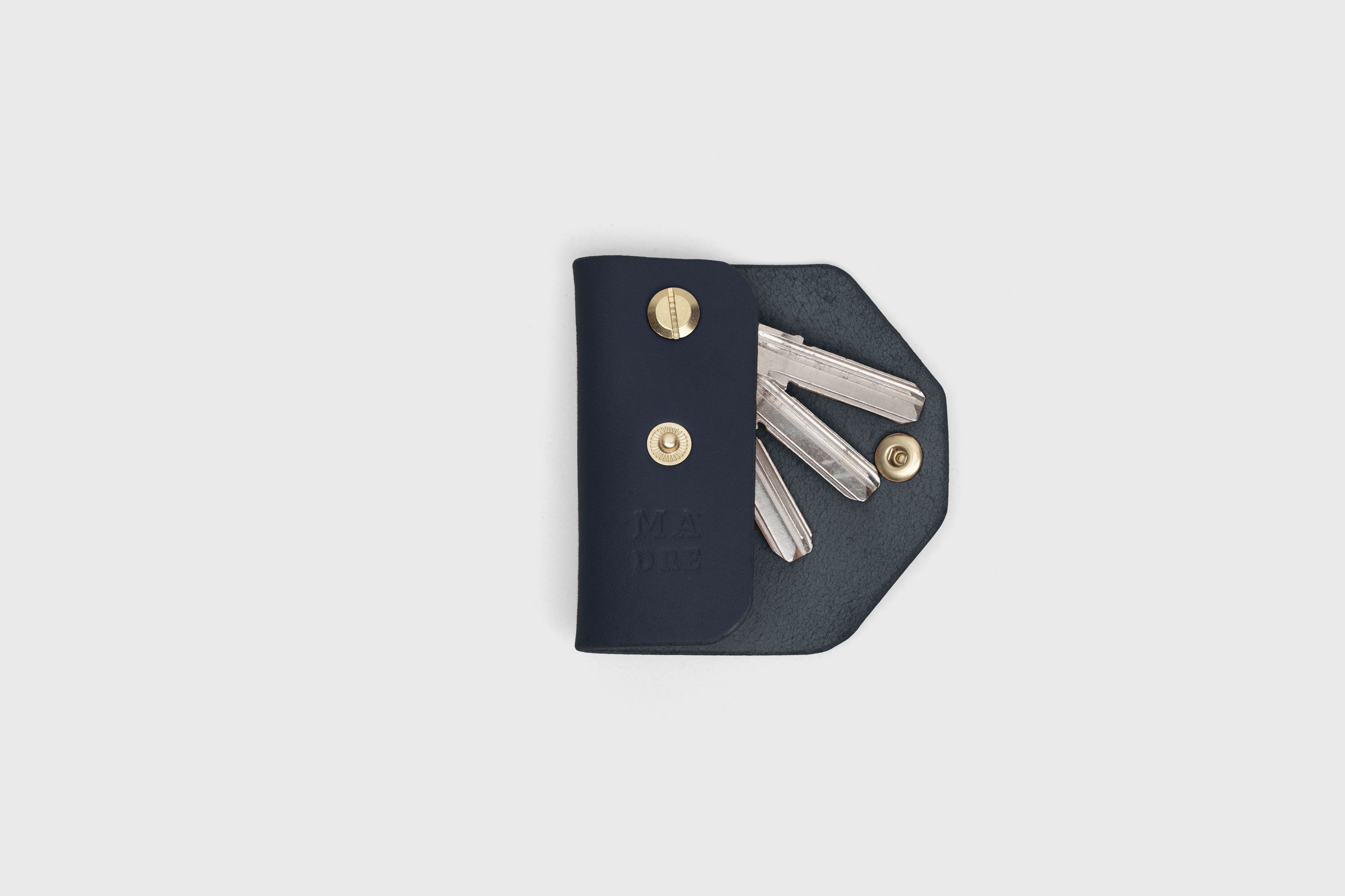 Key Etui In Marine Blue Color In Vegetable Tanned Leather Key Holder With Snap Button Minimalistic Design Atelier Madre Manuel Dreesmann Barcelona Spain