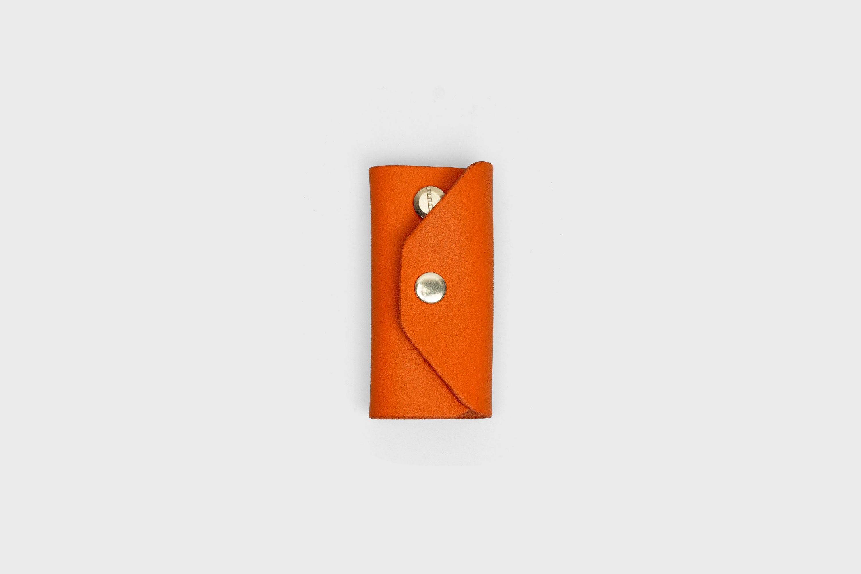 Key Etui In Orange Color In Vegetable Tanned Leather Key Holder With Snap Button Minimalistic Design Atelier Madre Manuel Dreesmann Barcelona Spain