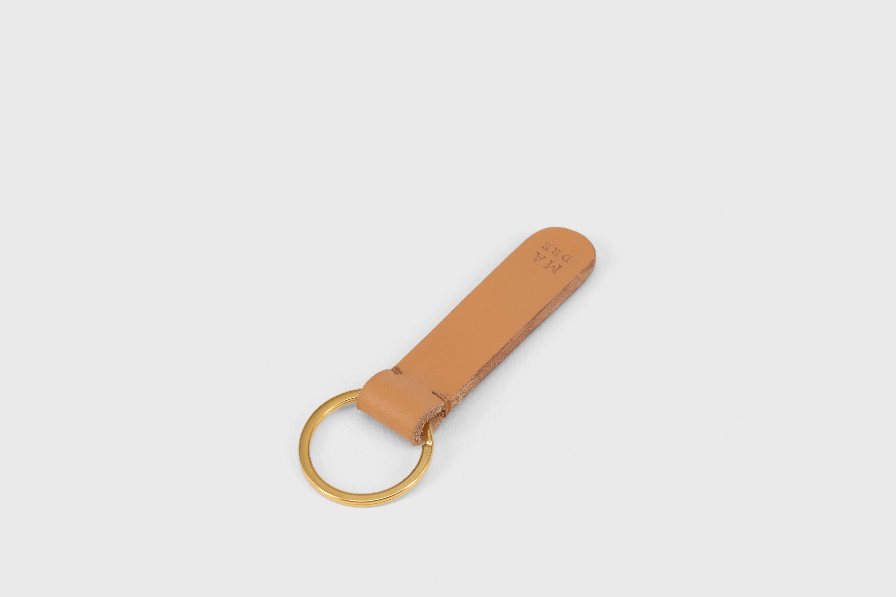 Key Ring Leather Brown Color Fob Minimalist Designer Vegetable Tanned Full Grain Handcrafted Personalised Premium Quality Gold Atelier Madre Manuel Dreesmann Barcelona Spain