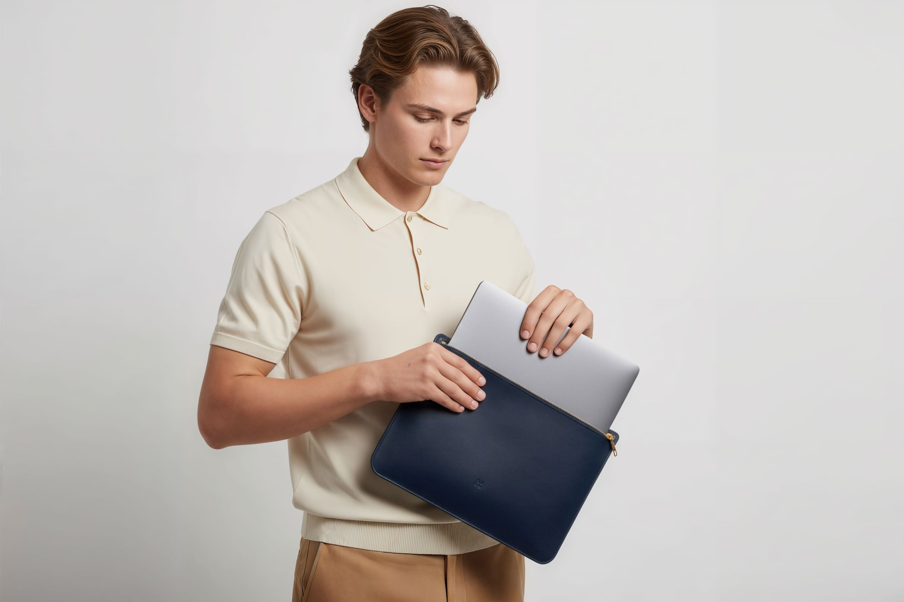 MacBook Sleeve Zipper Marine Blue Leather Horizontal On Model Grey Background Minimalistic Premium Design Atelier Madre Manuel Dreesmann Barcelona