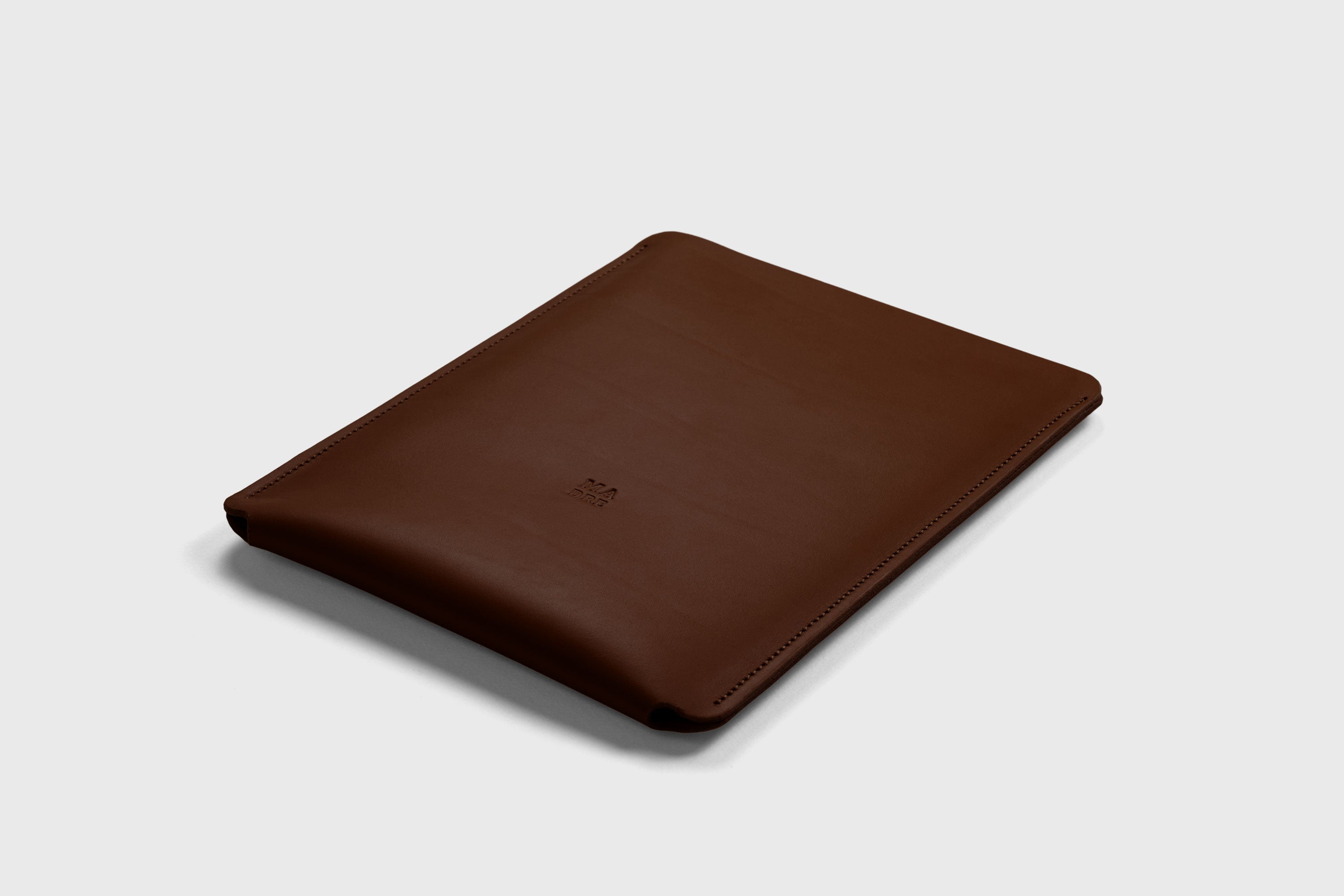 Leather Slip Sleeve For iPad Dark Brown Color Premium Handcrafted Quality Full Grain Vegetable Tanned Leather Minimalistic Modern Independent Designer Atelier Madre Manuel Dreesmann Barcelona Spain