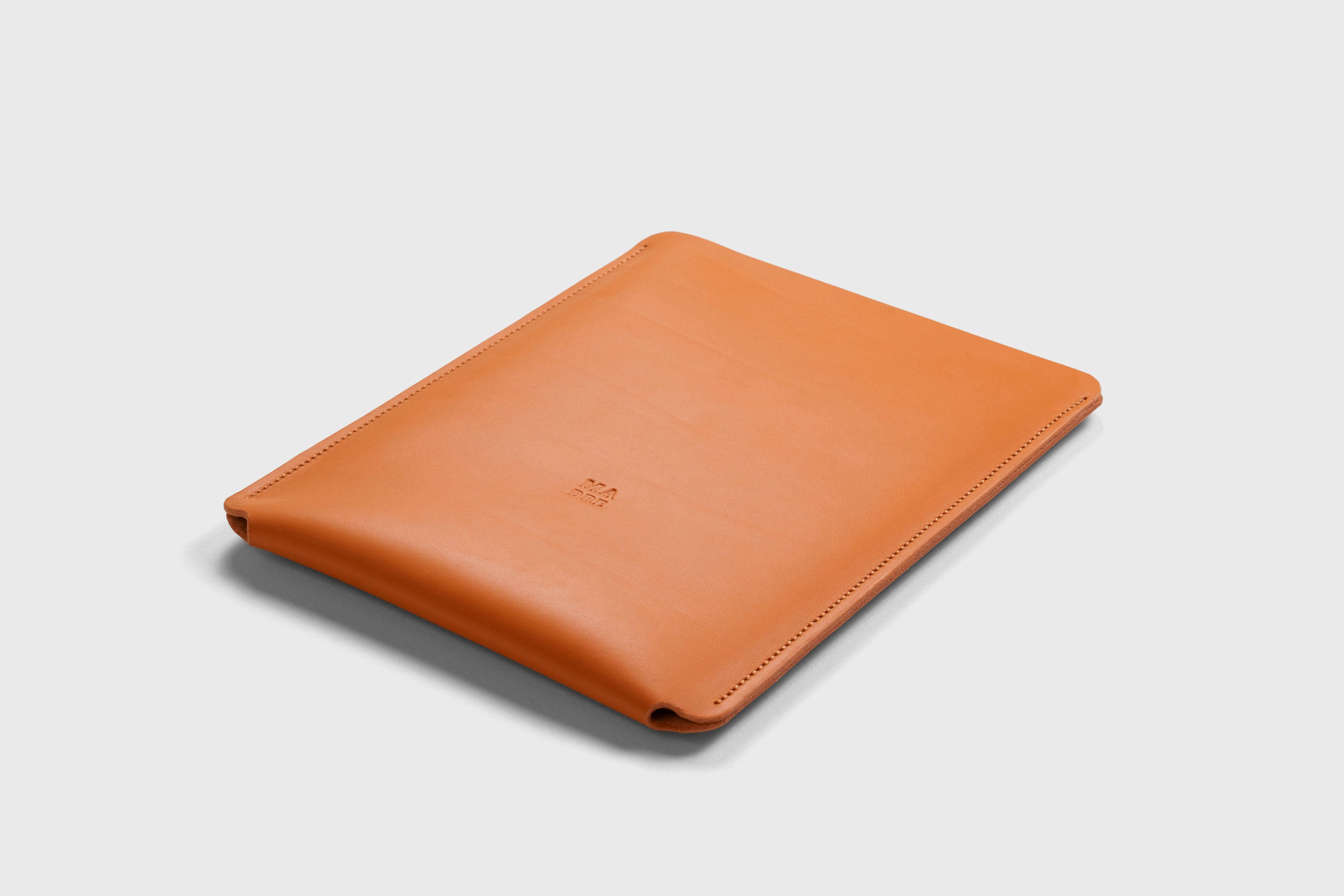 Leather Slip Sleeve For iPad Orange Color Premium Handcrafted Quality Full Grain Vegetable Tanned Leather Minimalistic Modern Independent Designer Atelier Madre Manuel Dreesmann Barcelona Spain