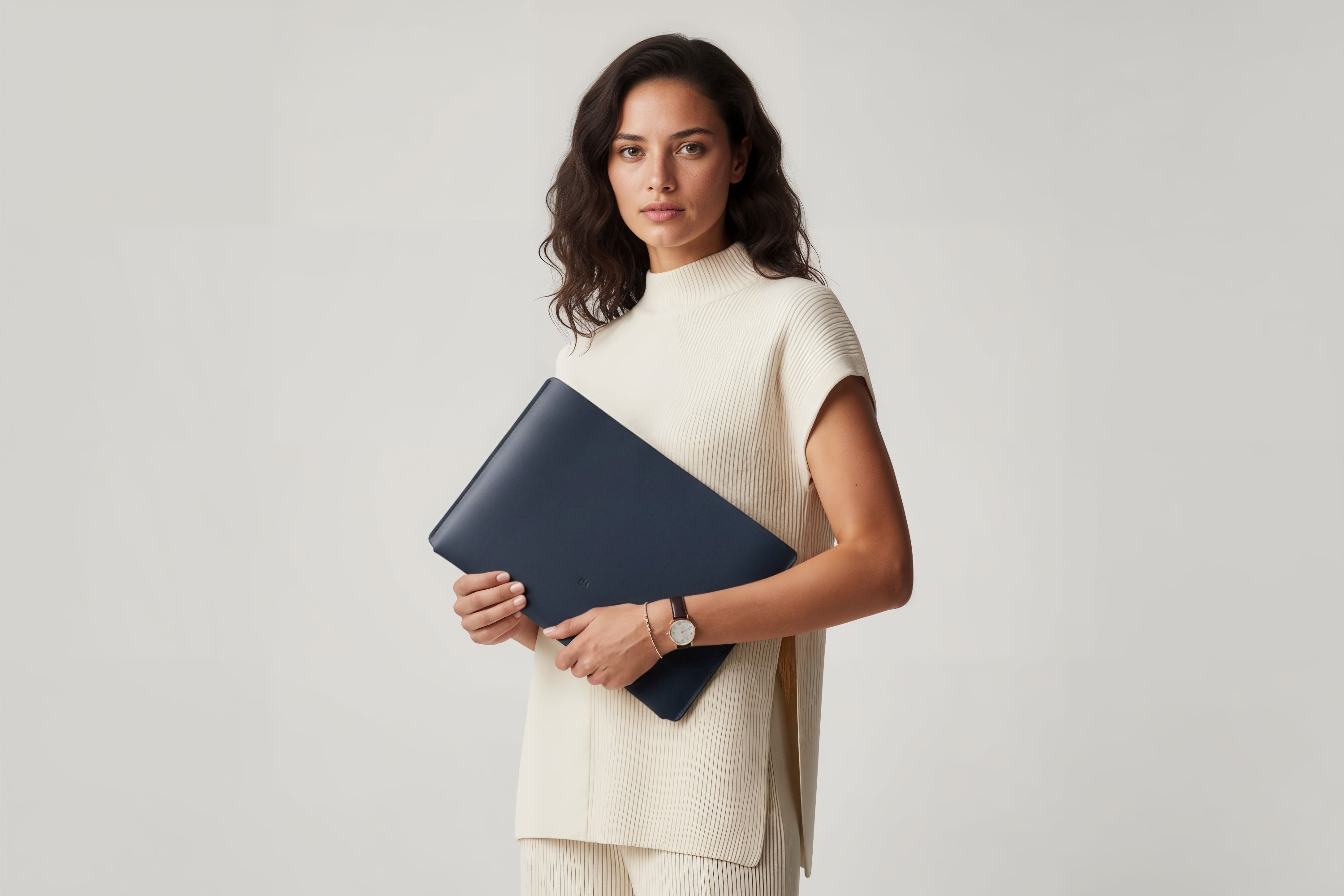 MacBook Slip Sleeve Marine Blue Leather Horizontal On Model Grey Background Minimalistic Premium Design Atelier Madre Manuel Dreesmann Barcelona