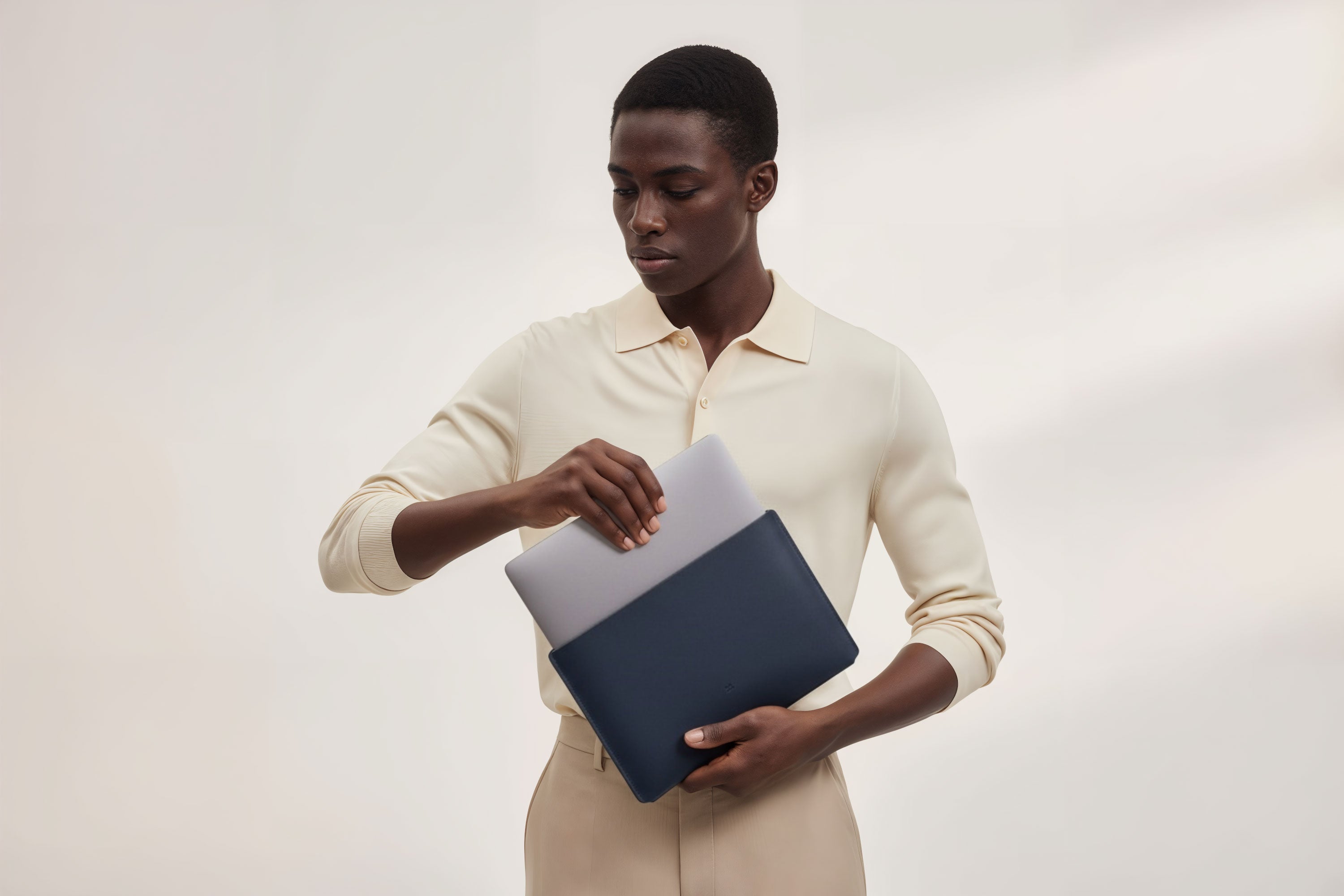 MacBook Slip Sleeve Marine Blue Leather Horizontal On Model Grey Background Minimalistic Premium Design Atelier Madre Manuel Dreesmann Barcelona