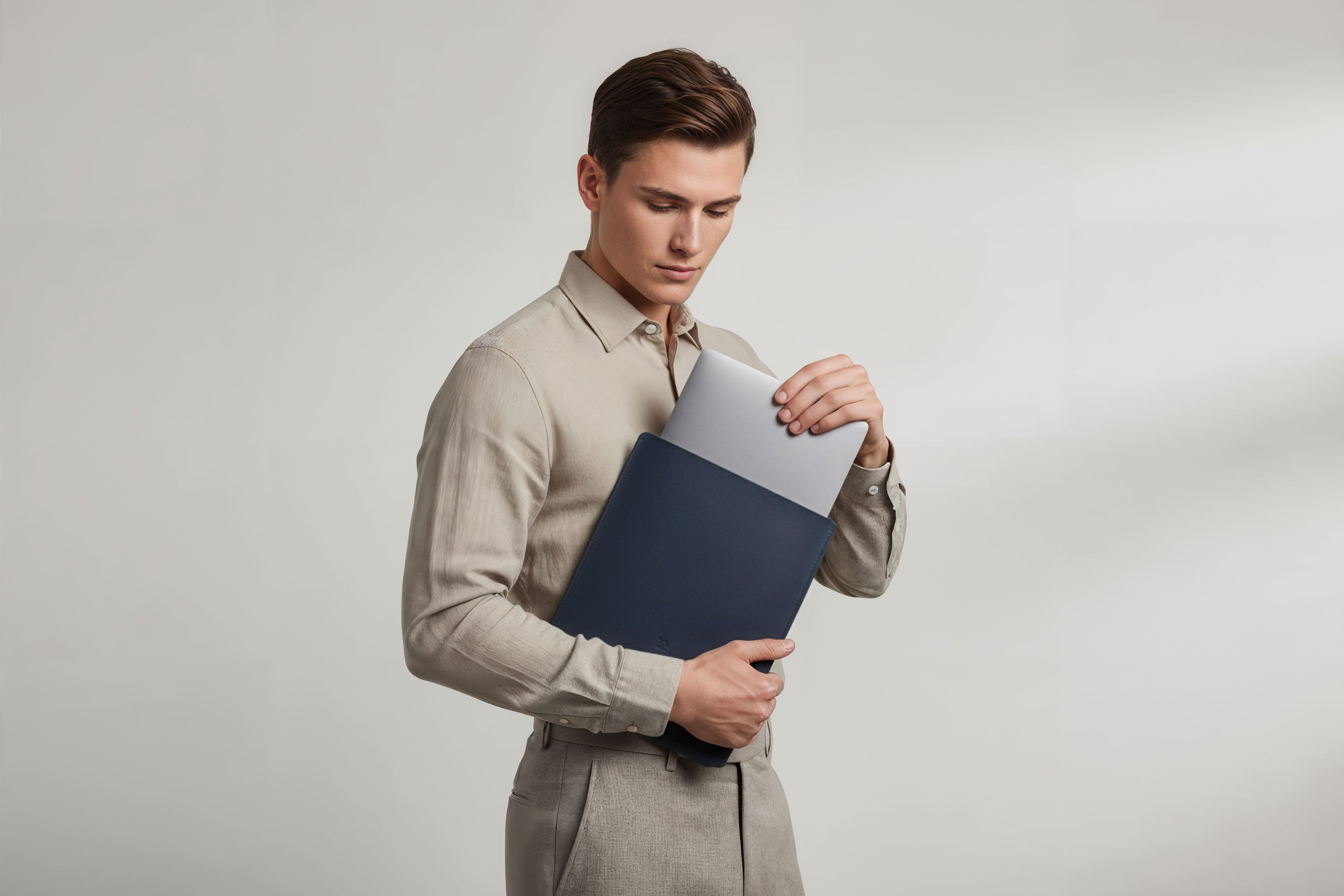 MacBook Slip Sleeve Marine Blue Color Leather On Model Grey Background Minimalistic Premium Design Atelier Madre Manuel Dreesmann Barcelona