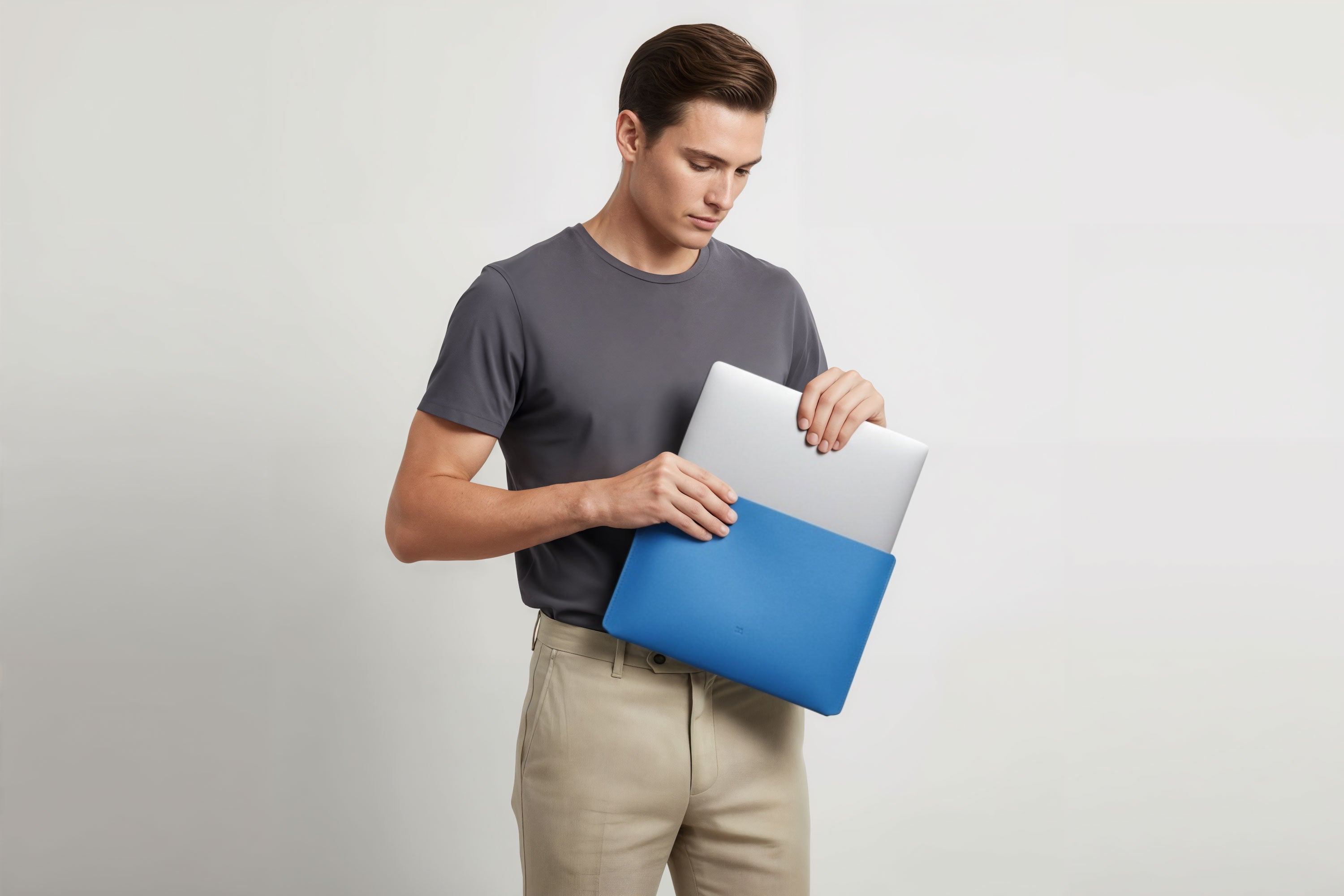 MacBook Slip Sleeve Royal Blue Horizontal On Model Grey Background Minimalistic Premium Design Atelier Madre Manuel Dreesmann Barcelona