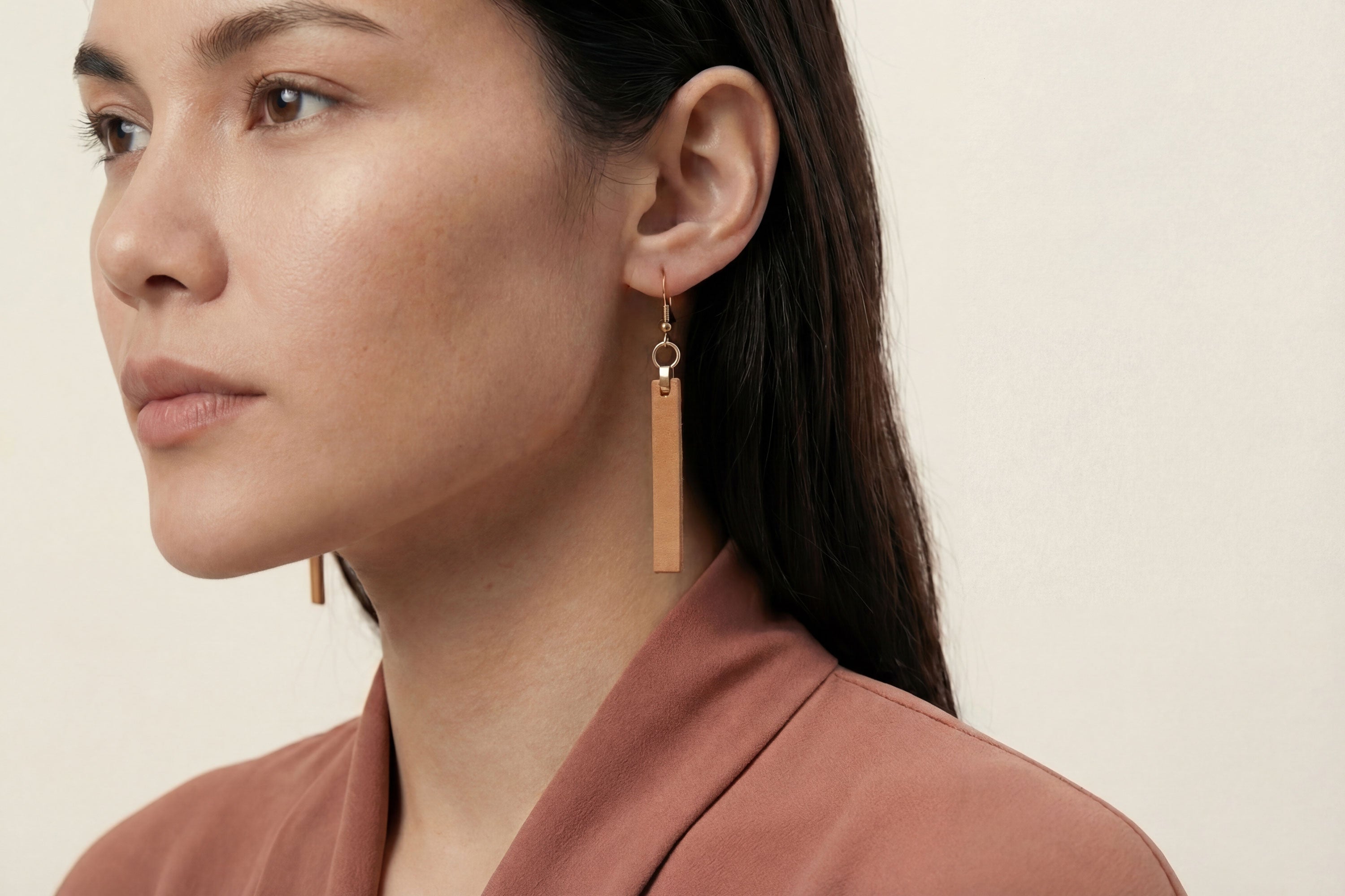 Lia Earrings Leather In Brown Color On Model Vegetable Tanned Leather Atelier Madre Manuel Dreesmann Barcelona Spain