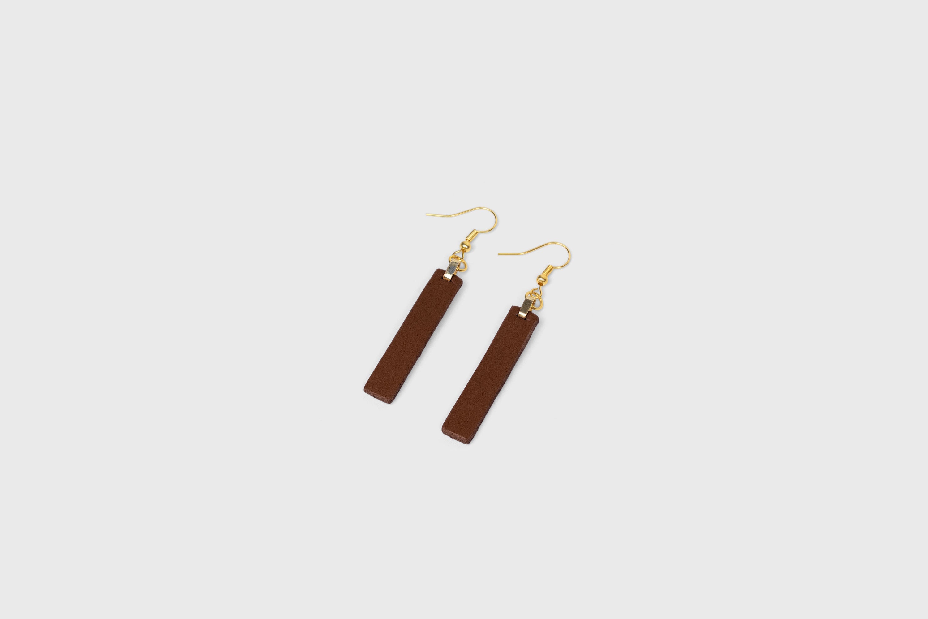 Lia Earrings Leather In Dark Brown Color Vegetable Tanned Leather Atelier Madre Manuel Dreesmann Barcelona Spain
