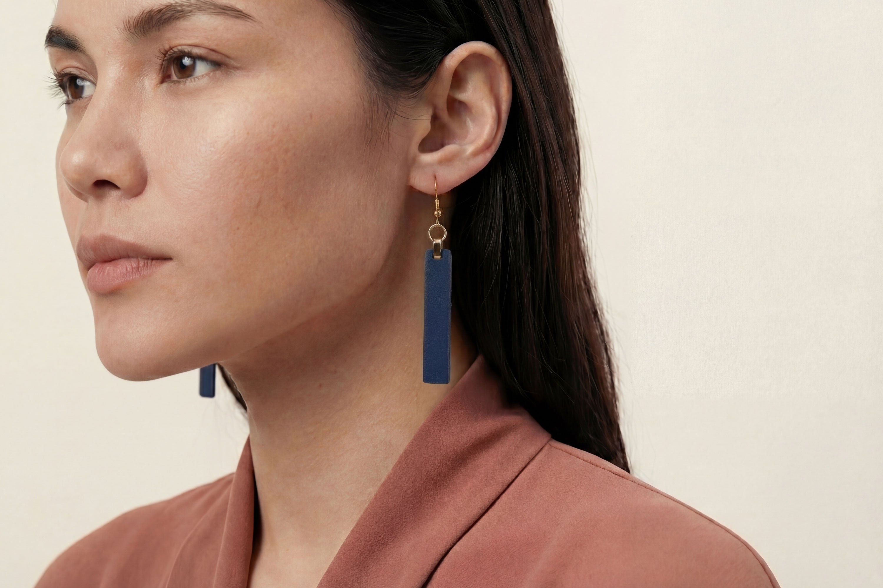 Lia Earrings Leather In Marine Blue Color On Model Vegetable Tanned Leather Atelier Madre Manuel Dreesmann Barcelona Spain