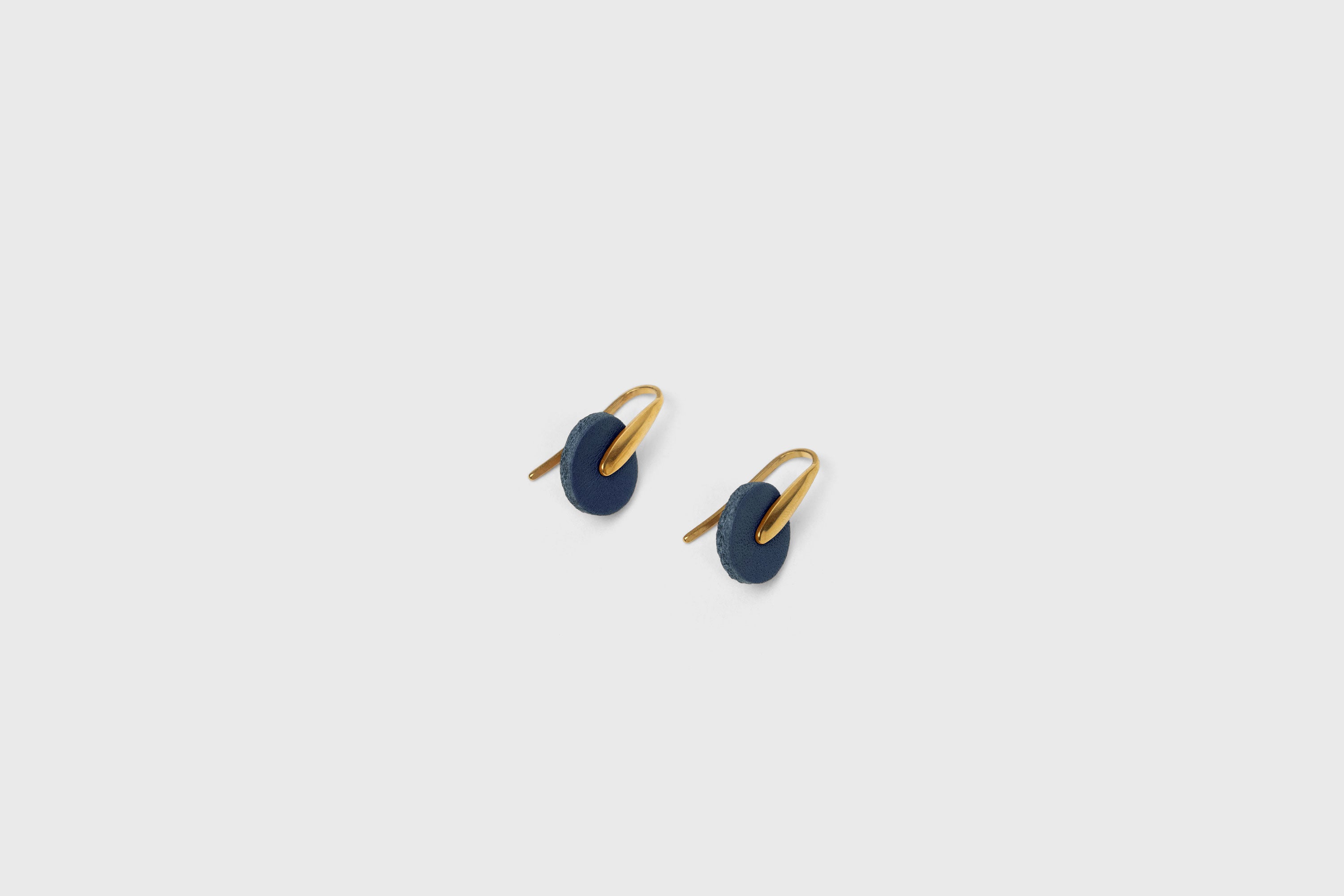 Lina Earrings In Marine Blue Color In Vegetable Tanned Leather Brass Hook Minimalistic Design Atelier Madre Manuel Dreesmann Barcelona Spain