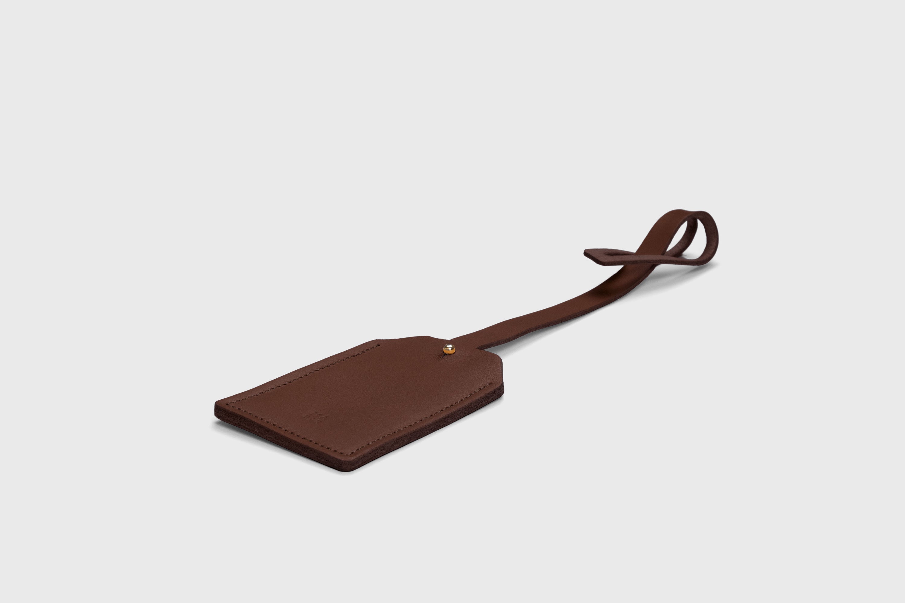 Luggage Tag Holder Leather Dark Brown Color Premium Quality Minimalist Design Atelier Madre Manuel Dreesmann Barcelona Spain