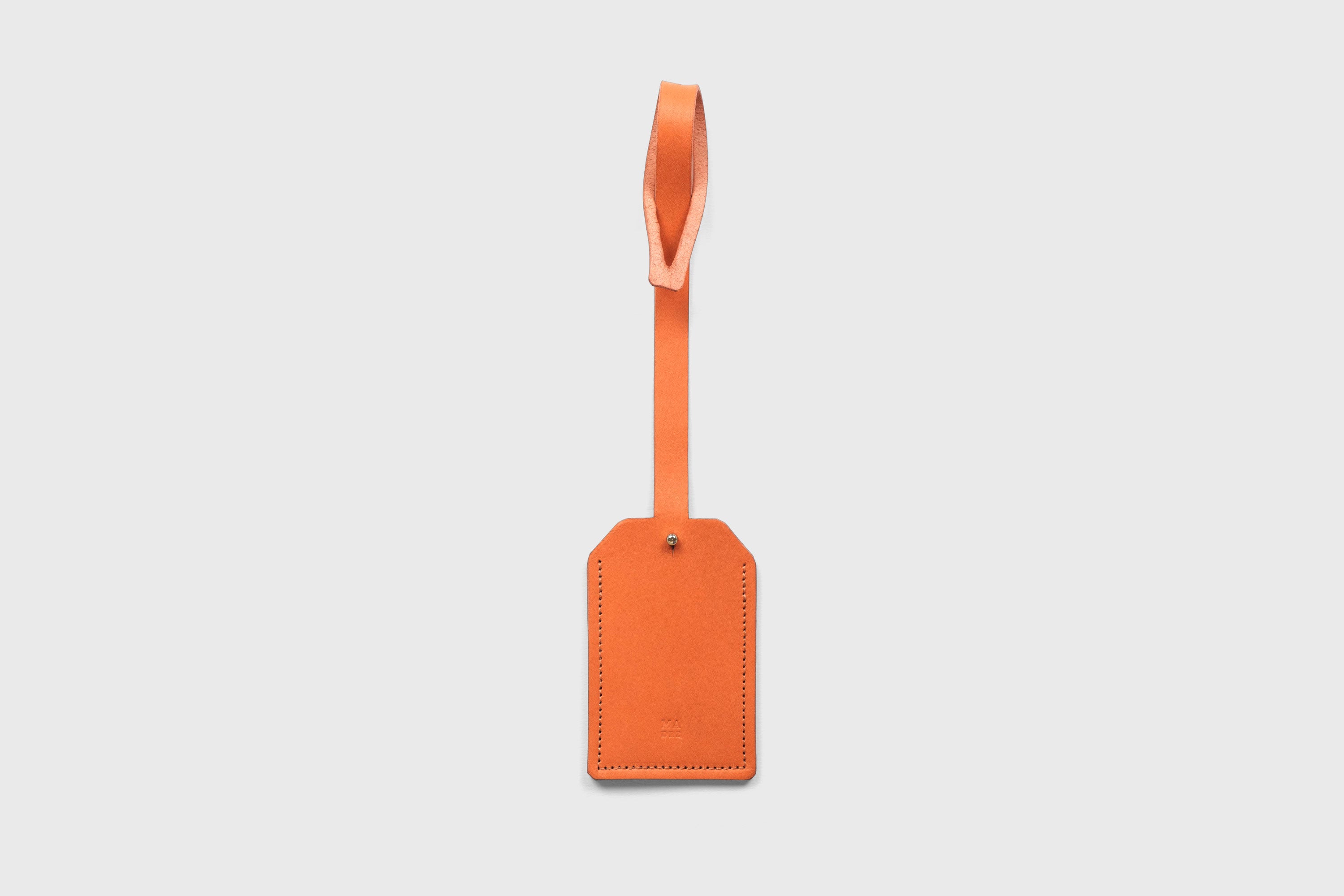 Luggage Tag Holder Leather Orange Color Premium Quality Minimalist Design Atelier Madre Manuel Dreesmann Barcelona Spain