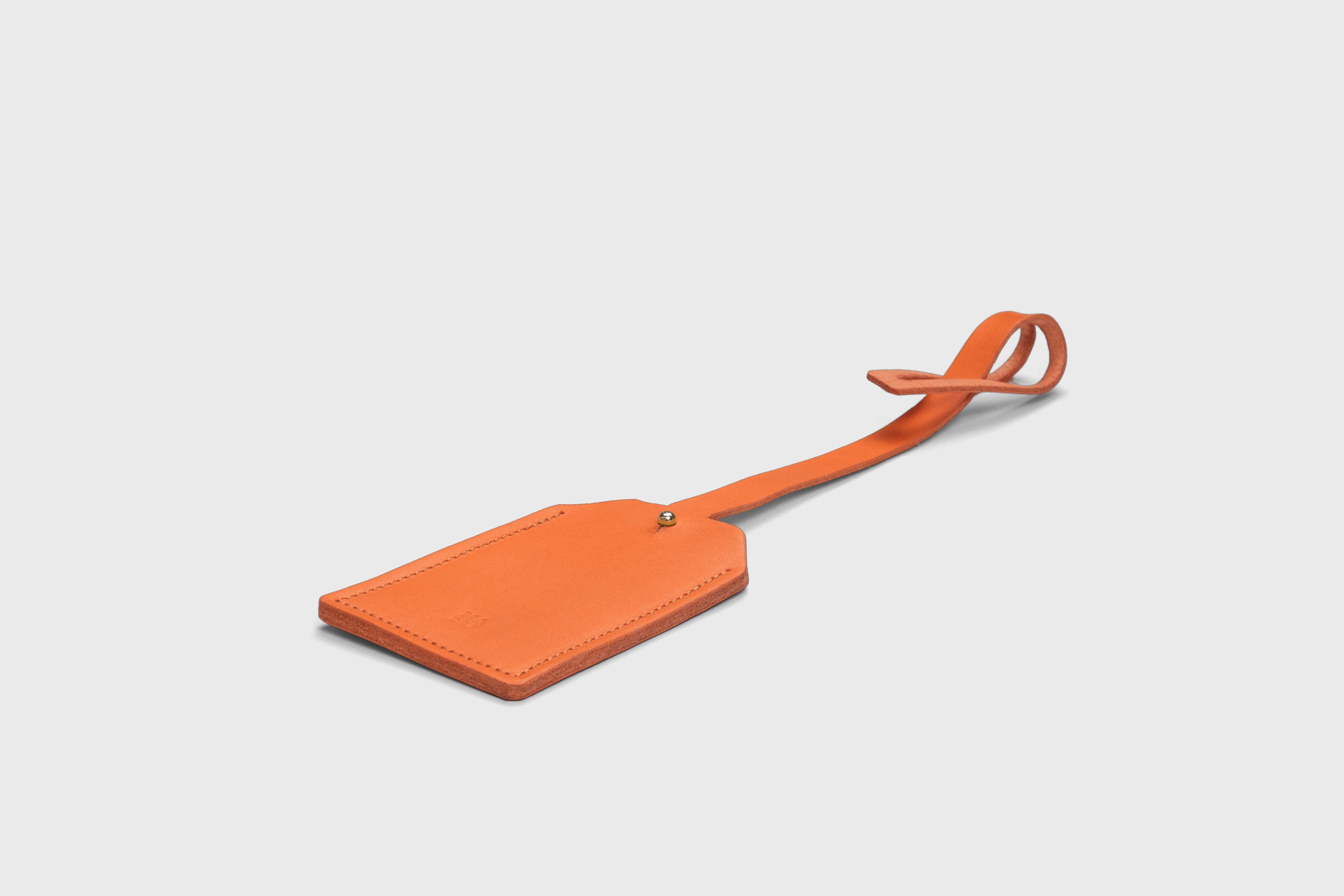 Luggage Tag Holder Leather Orange Color Premium Quality Minimalist Design Atelier Madre Manuel Dreesmann Barcelona Spain