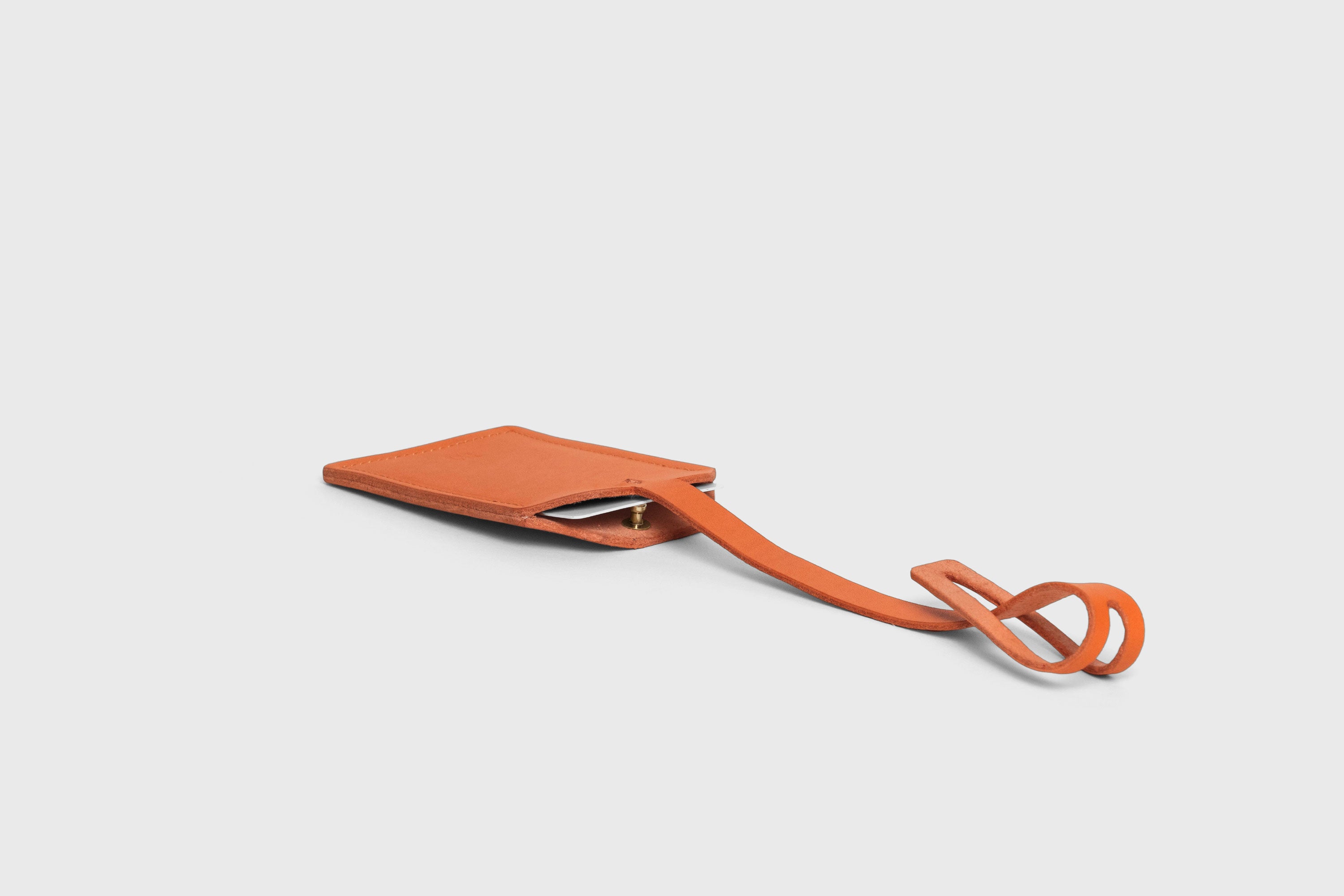 Luggage Tag Holder Leather Orange Color Premium Quality Minimalist Design Atelier Madre Manuel Dreesmann Barcelona Spain