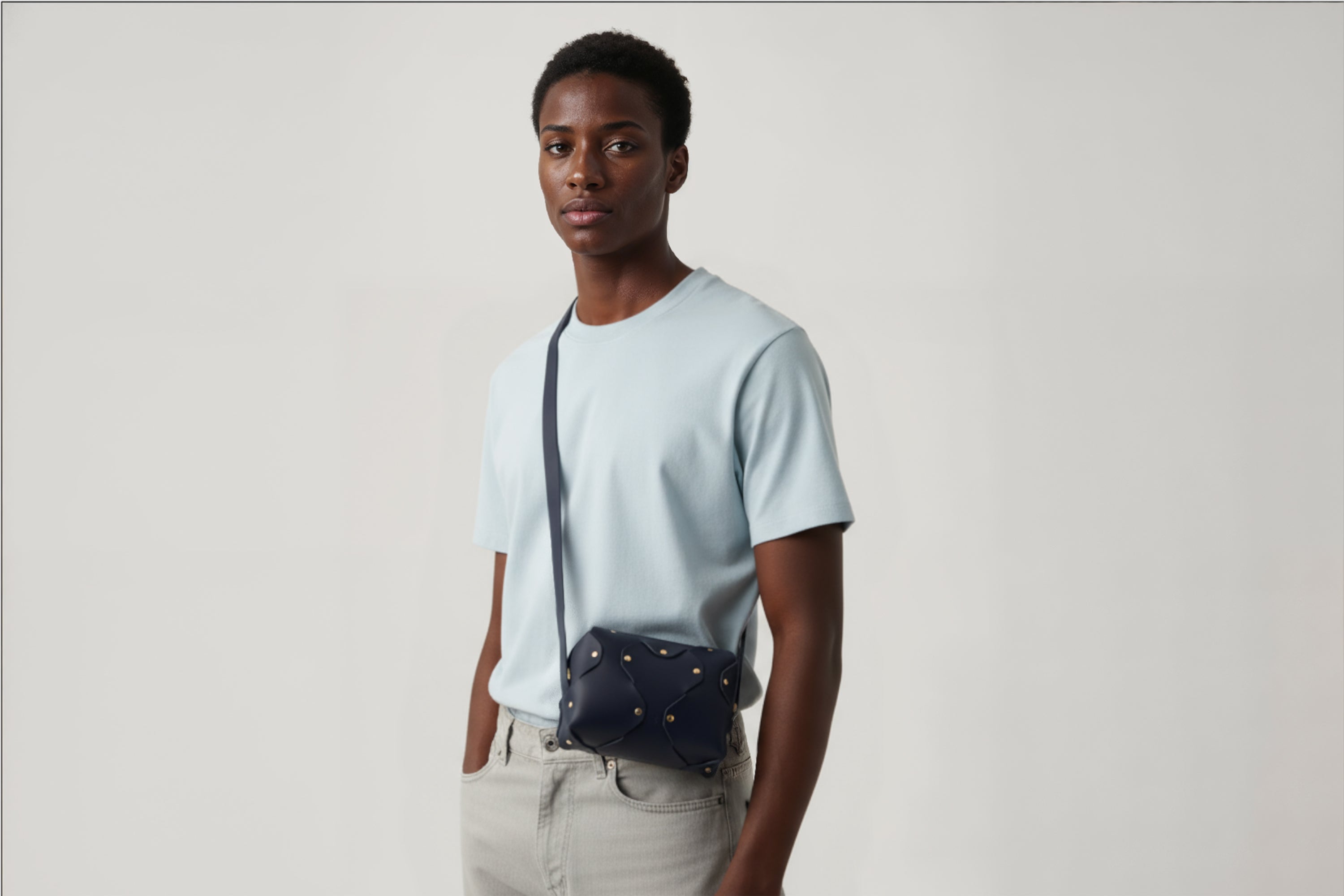 Marlin Leather Bag Small Marine Blue Color On A Man Model Premium Quality Minimalist Design Atelier Madre Manuel Dreesmann Barcelona Spain