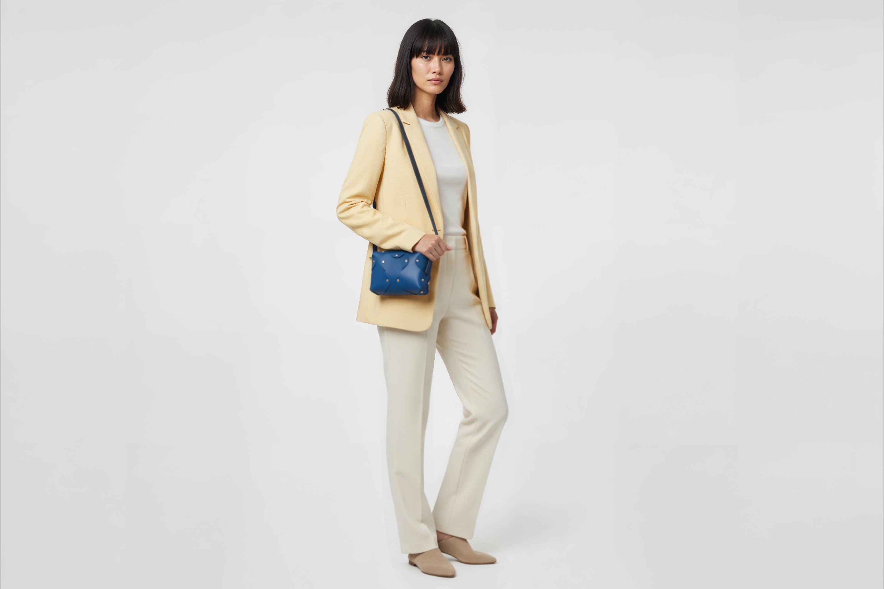 Marlin Leather Bag Small Royal Blue Color On A Woman Model Premium Quality Minimalist Design Atelier Madre Manuel Dreesmann Barcelona Spain