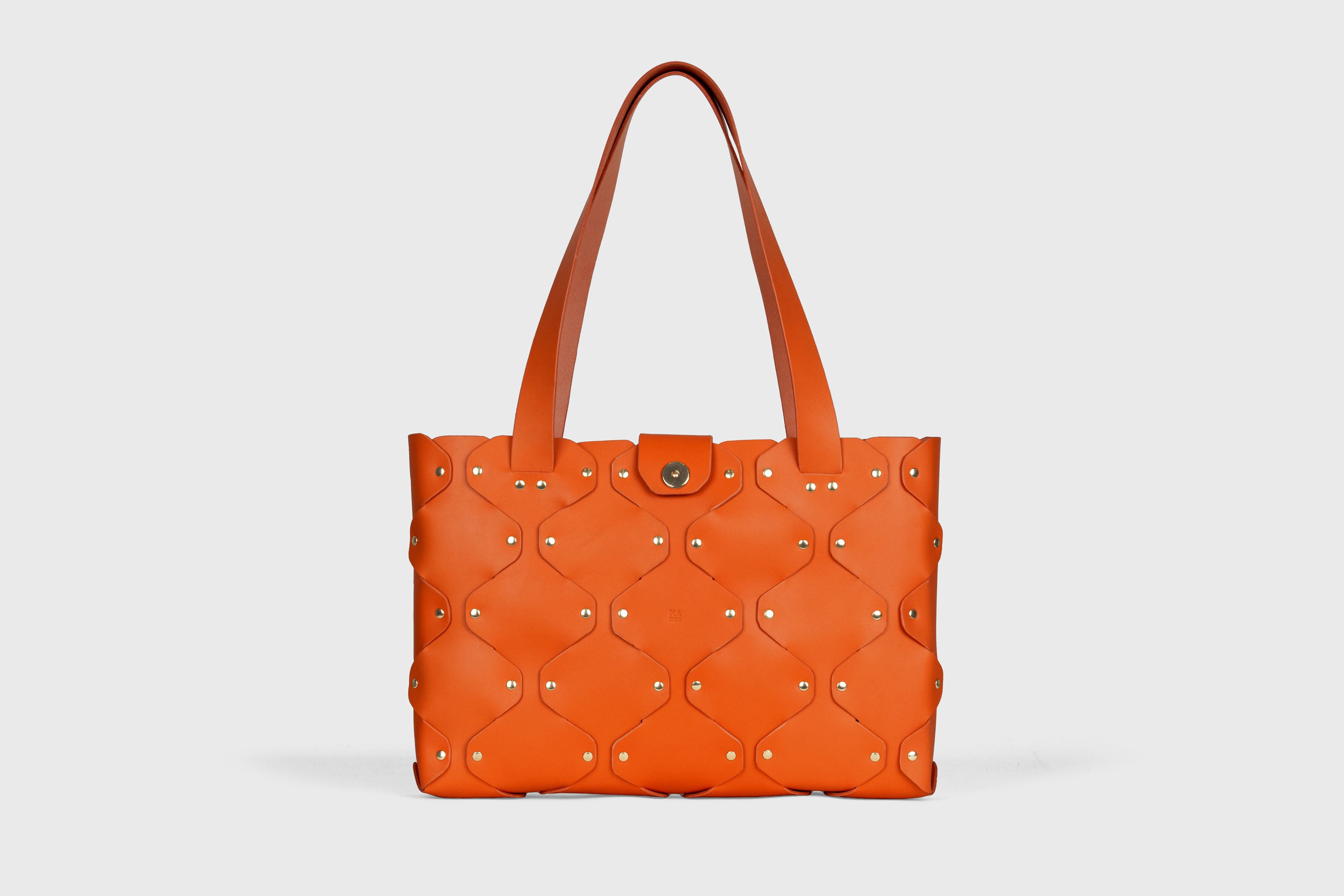 Marlin Tote Bag In Orange Color In Vegetable Tanned Leather With Rivets Atelier Madre Manuel Dreesmann Barcelona Spain