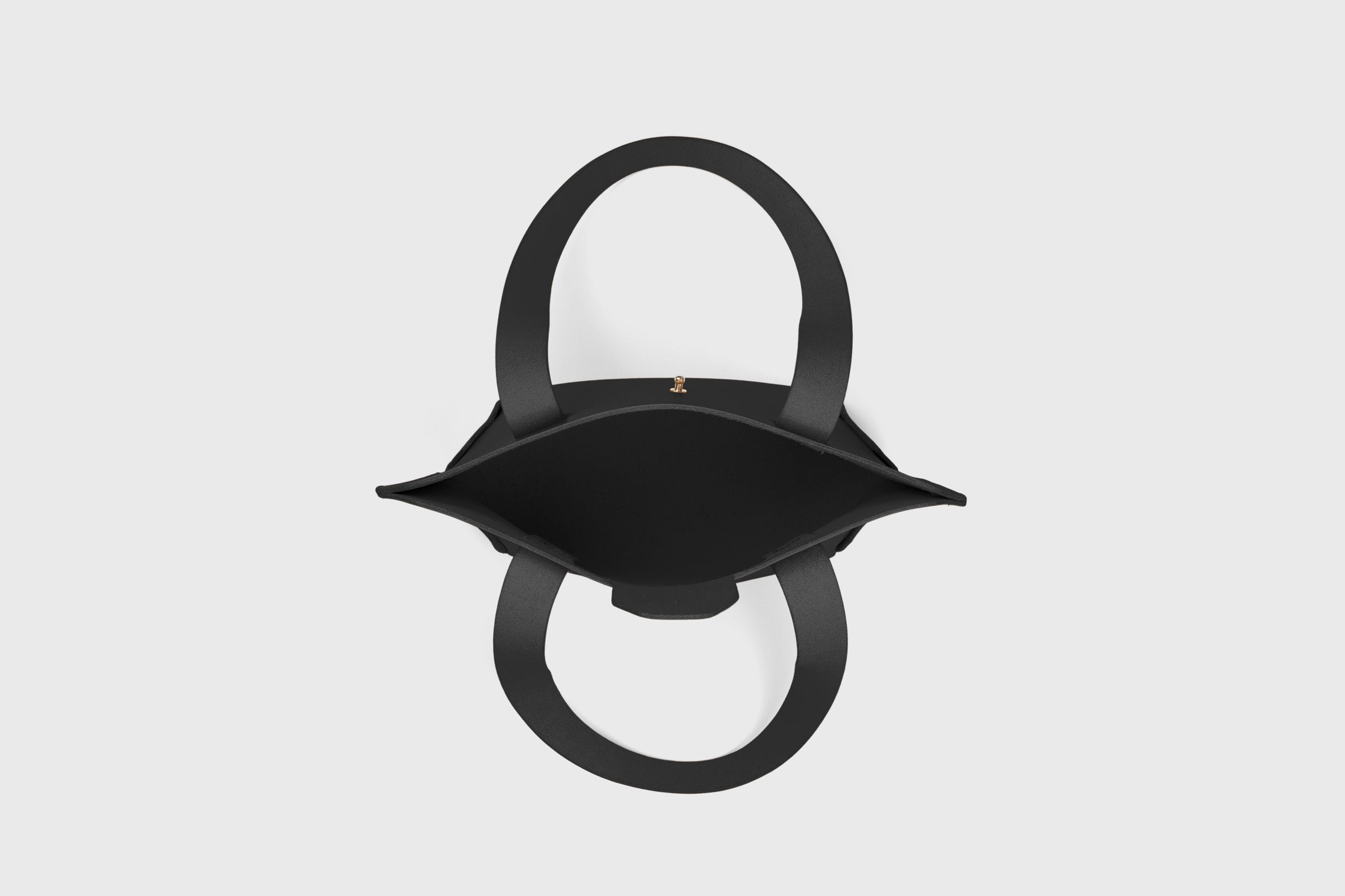 Mini Tote Bag In Black Color In Vegetable Tanned Leather Bag With A Flap In Minimalistic Design Atelier Madre Manuel Dreesmann