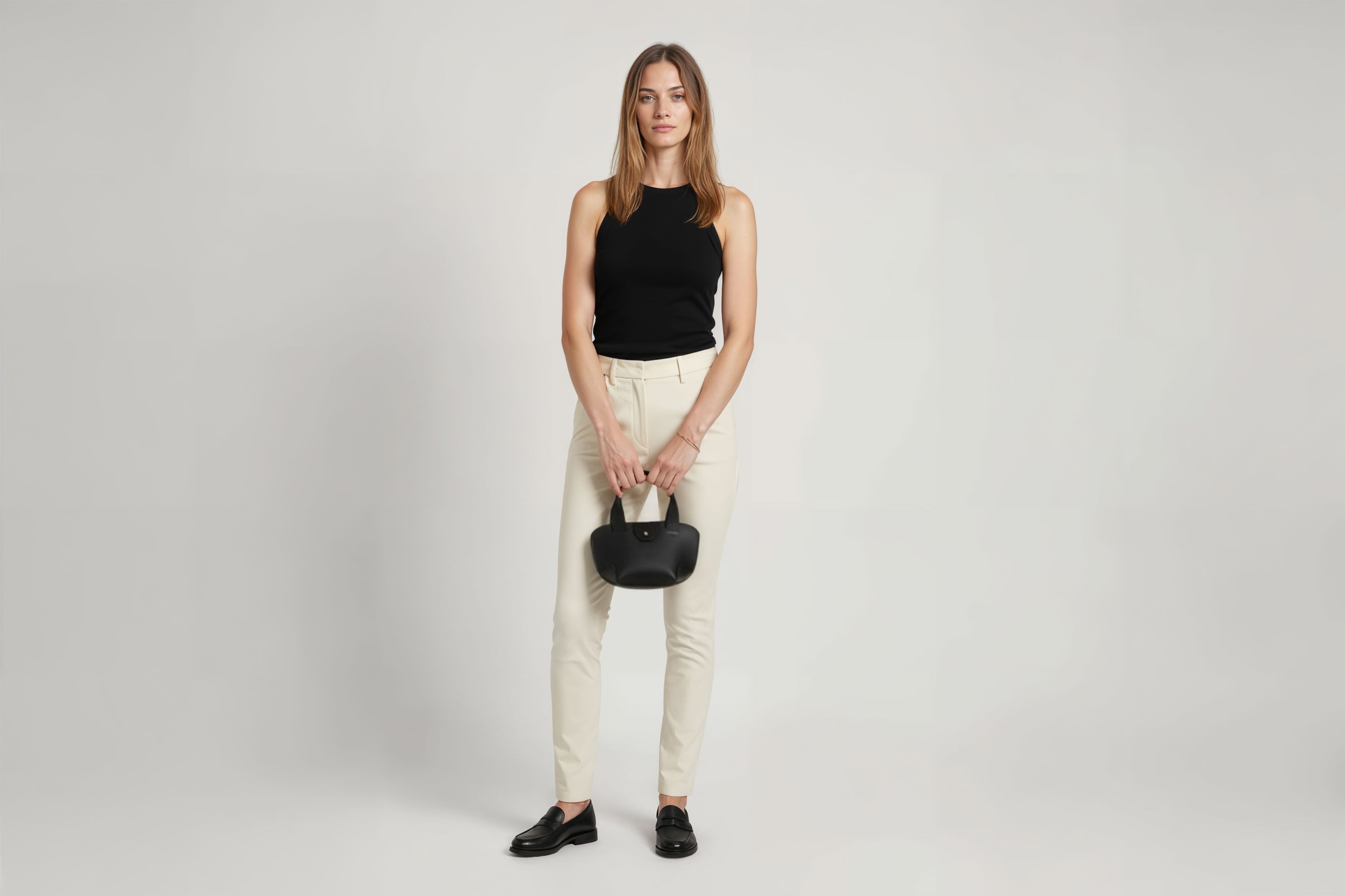 Mini Tote Bag Black Color Leather On A Woman Model Handbag Small Modern Minimalist Design Premium Quality Atelier Madre Manuel Dreesmann Barcelona Spain