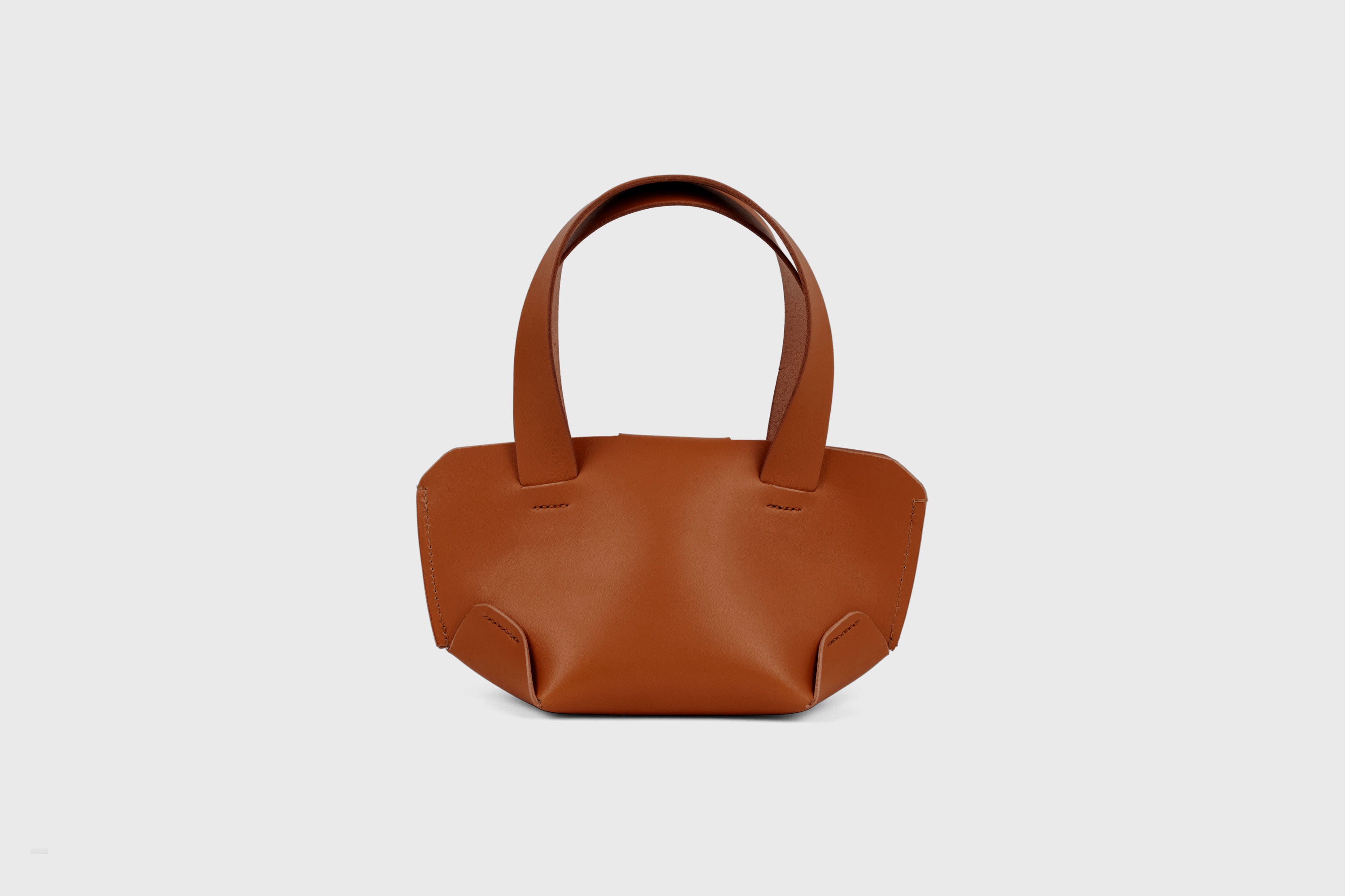 Mini Tote Bag Dark Brown Color Leather On A Woman Model Handbag Small Modern Minimalist Design Premium Quality Atelier Madre Manuel Dreesmann Barcelona Spain