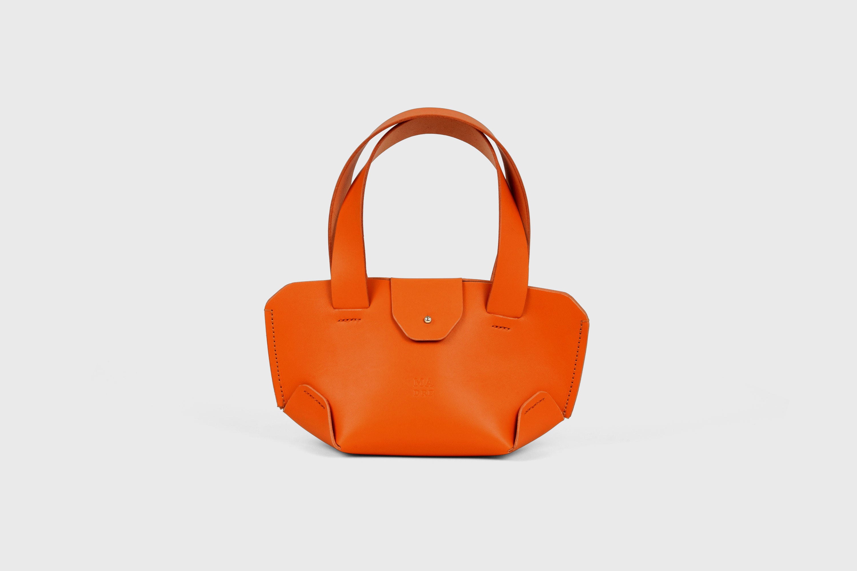 Mini Tote Bag In Orange Color In Vegetable Tanned Leather Bag With A Flap In Minimalistic Design Atelier Madre Manuel Dreesmann