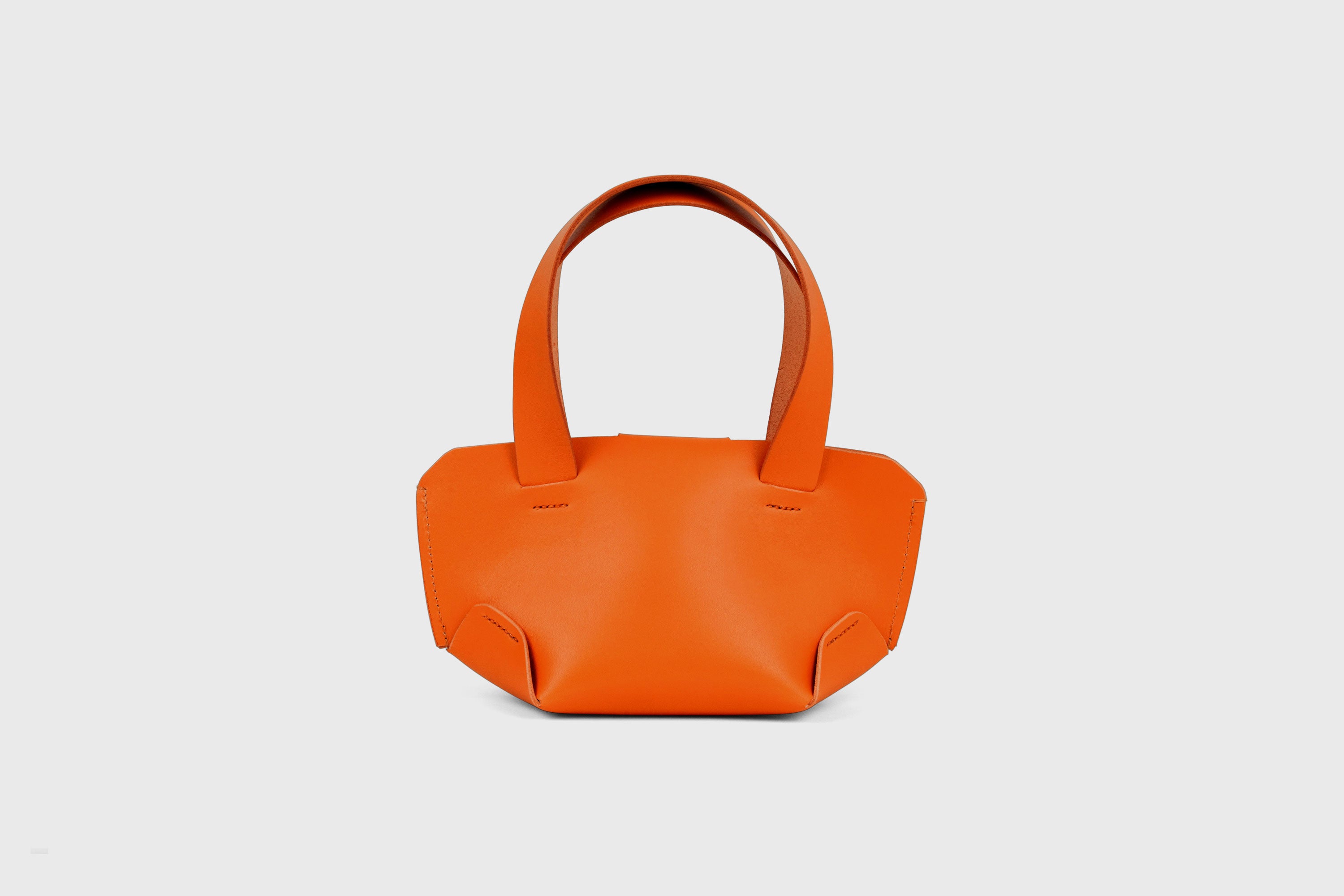 Mini Tote Bag In Orange Color In Vegetable Tanned Leather Bag With A Flap In Minimalistic Design Atelier Madre Manuel Dreesmann