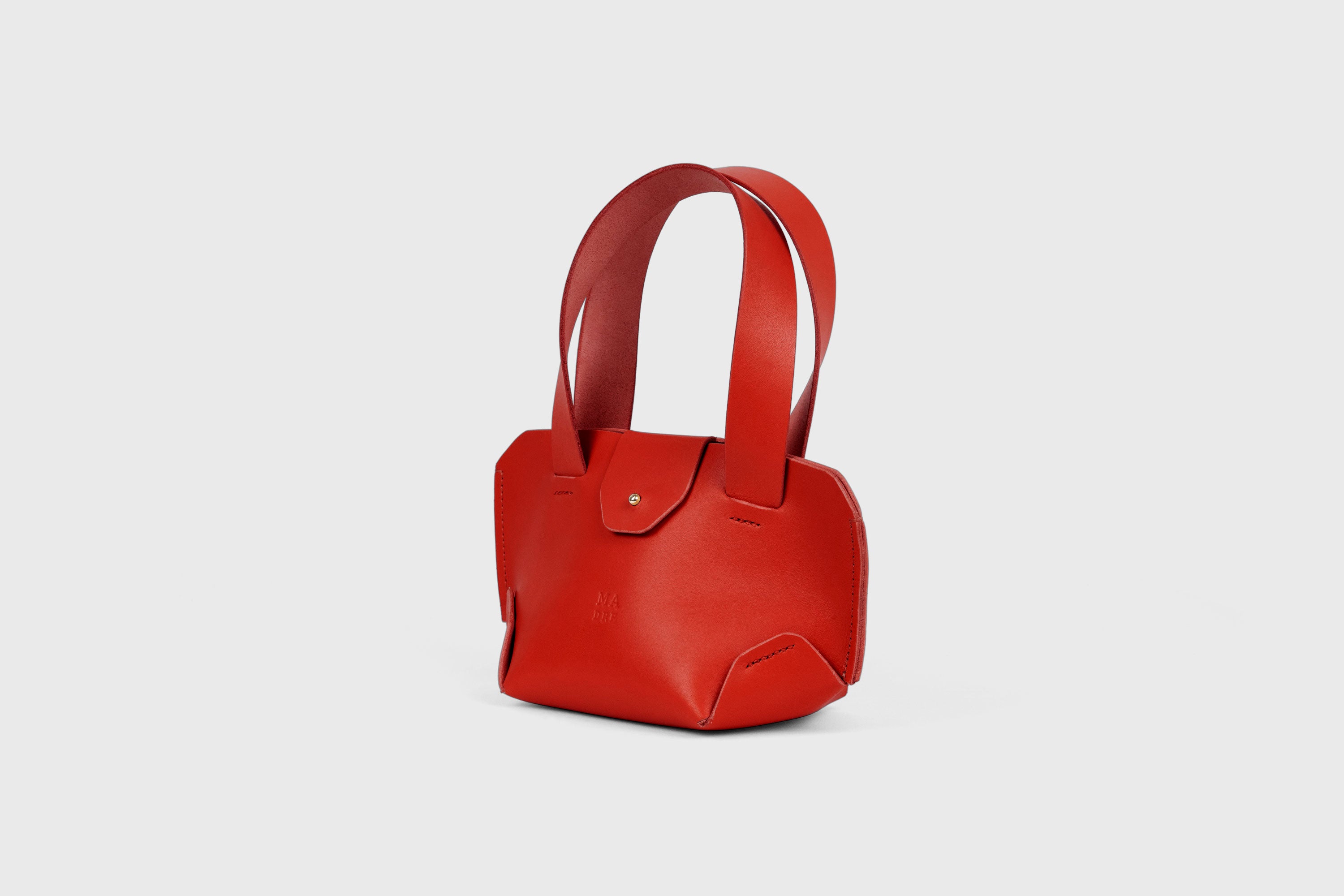 Mini Tote Bag In Red Color In Vegetable Tanned Leather Bag With A Flap In Minimalistic Design Atelier Madre Manuel Dreesmann