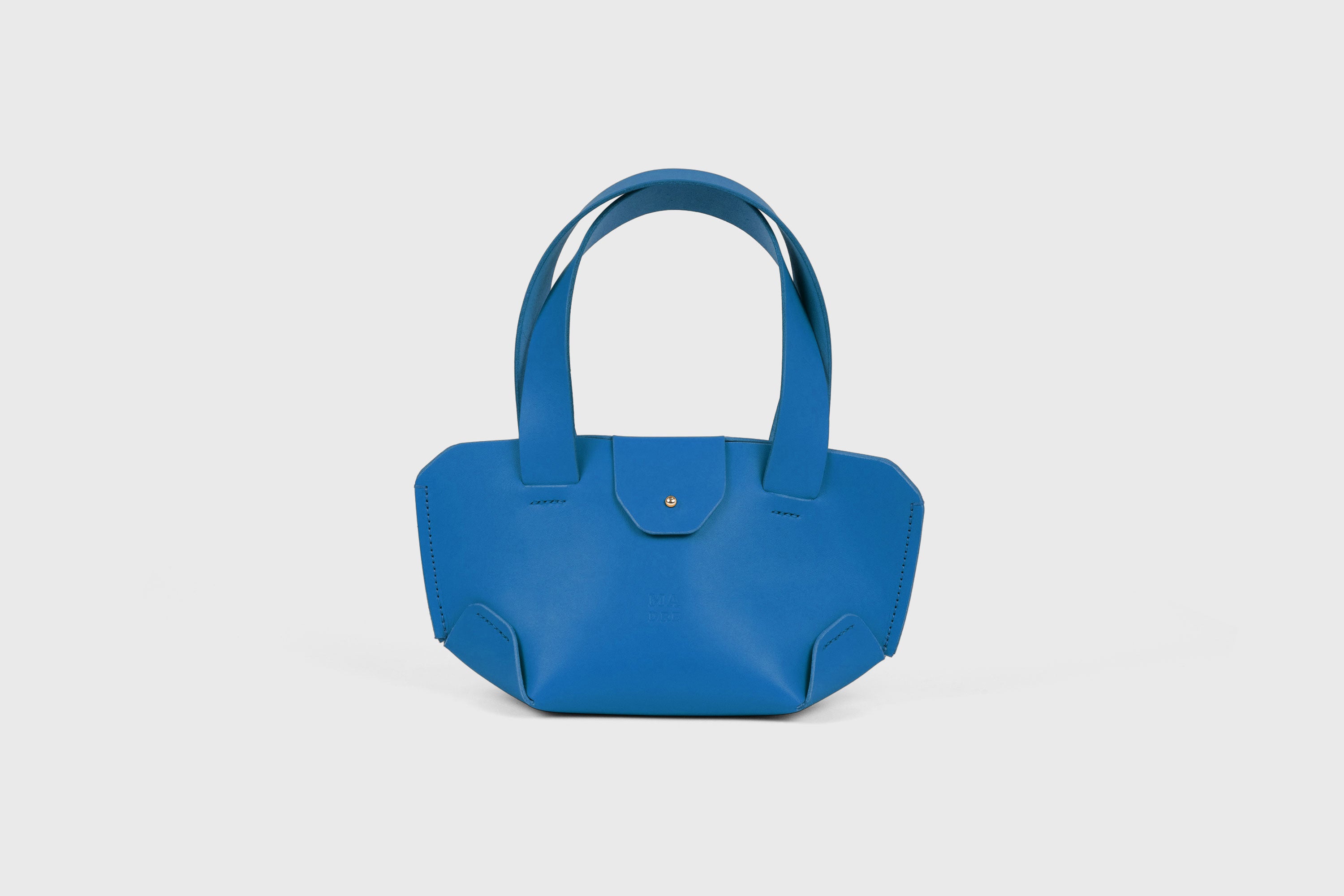 Mini Tote Bag In Royal Blue Color In Vegetable Tanned Leather Bag With A Flap In Minimalistic Design Atelier Madre Manuel Dreesmann