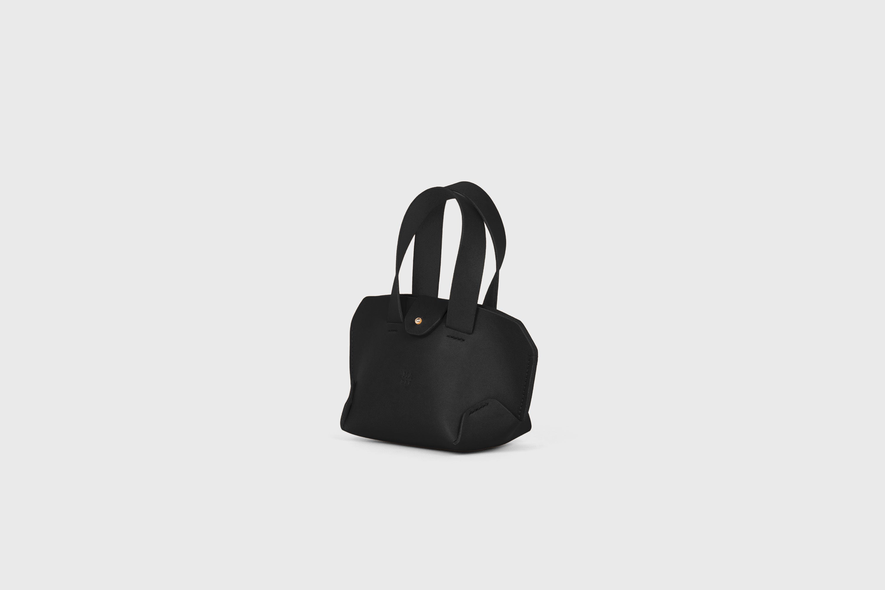 Nano Tote Bag In Black Color In Vegetable Tanned Leather Minimalistic Design Atelier Madre Manuel Dreesmann Barcelona Spain