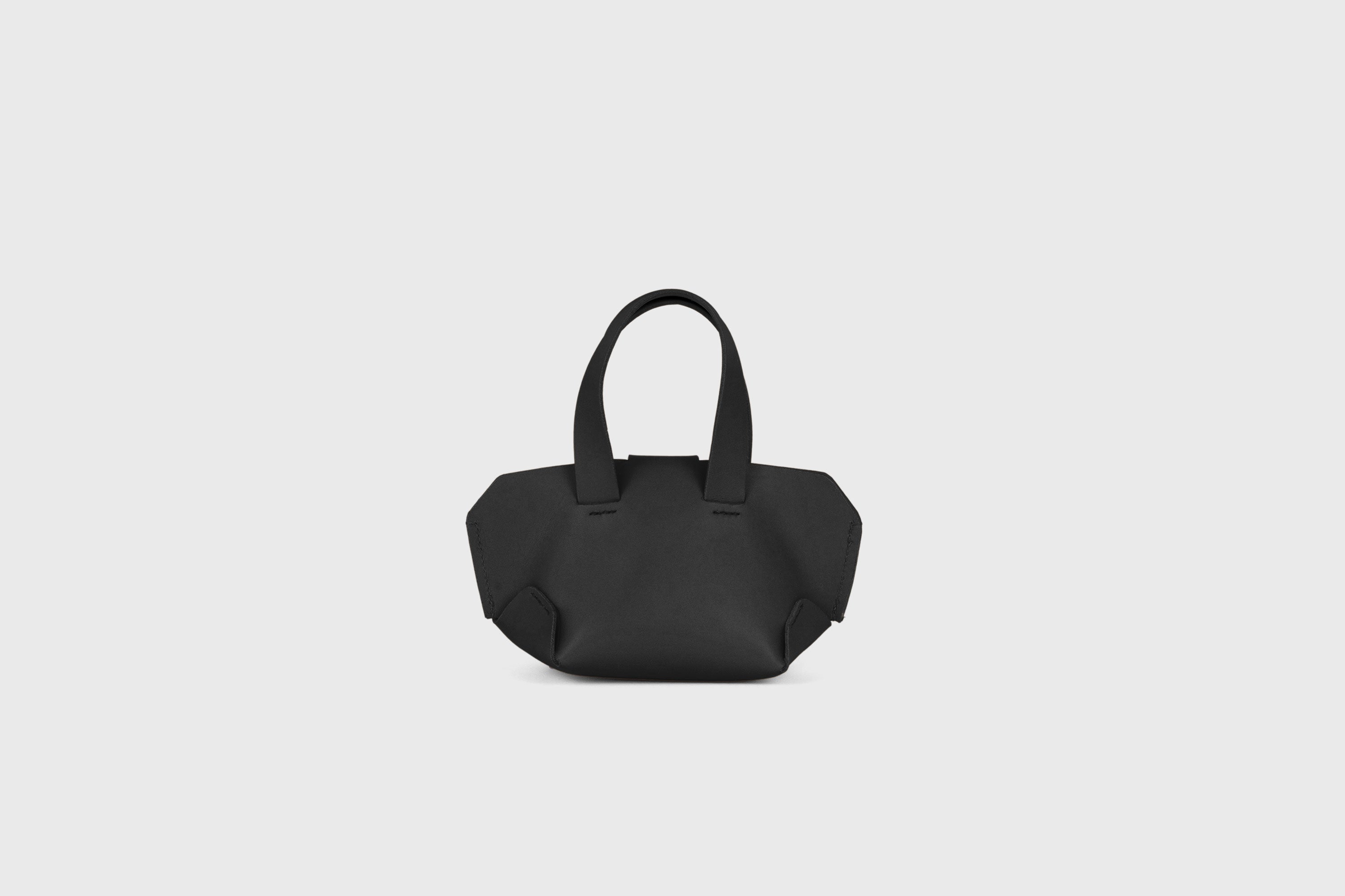Nano Tote Bag In Black Color In Vegetable Tanned Leather Minimalistic Design Atelier Madre Manuel Dreesmann Barcelona Spain