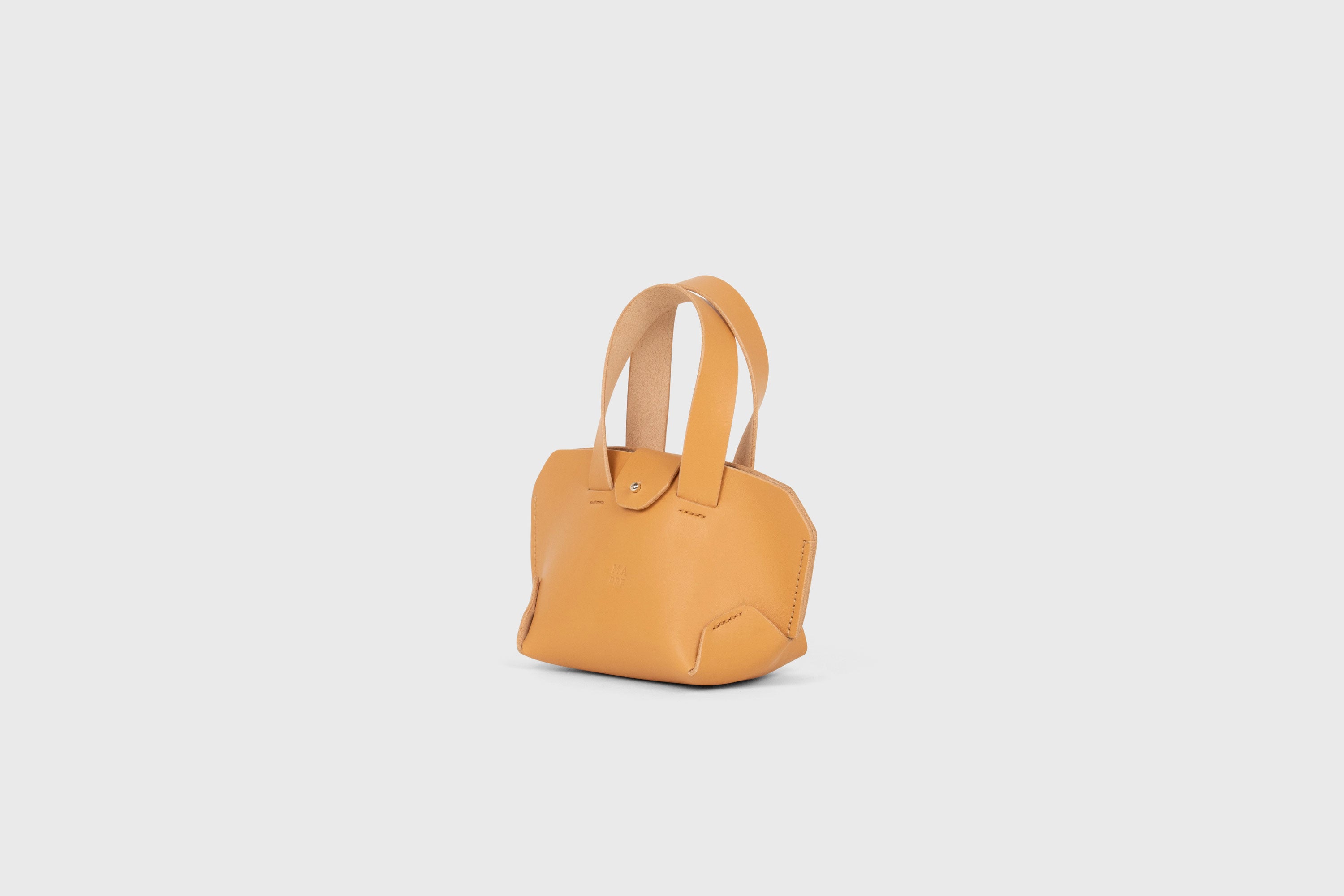 Nano Tote Bag In Brown Color In Vegetable Tanned Leather Minimalistic Design Atelier Madre Manuel Dreesmann Barcelona Spain