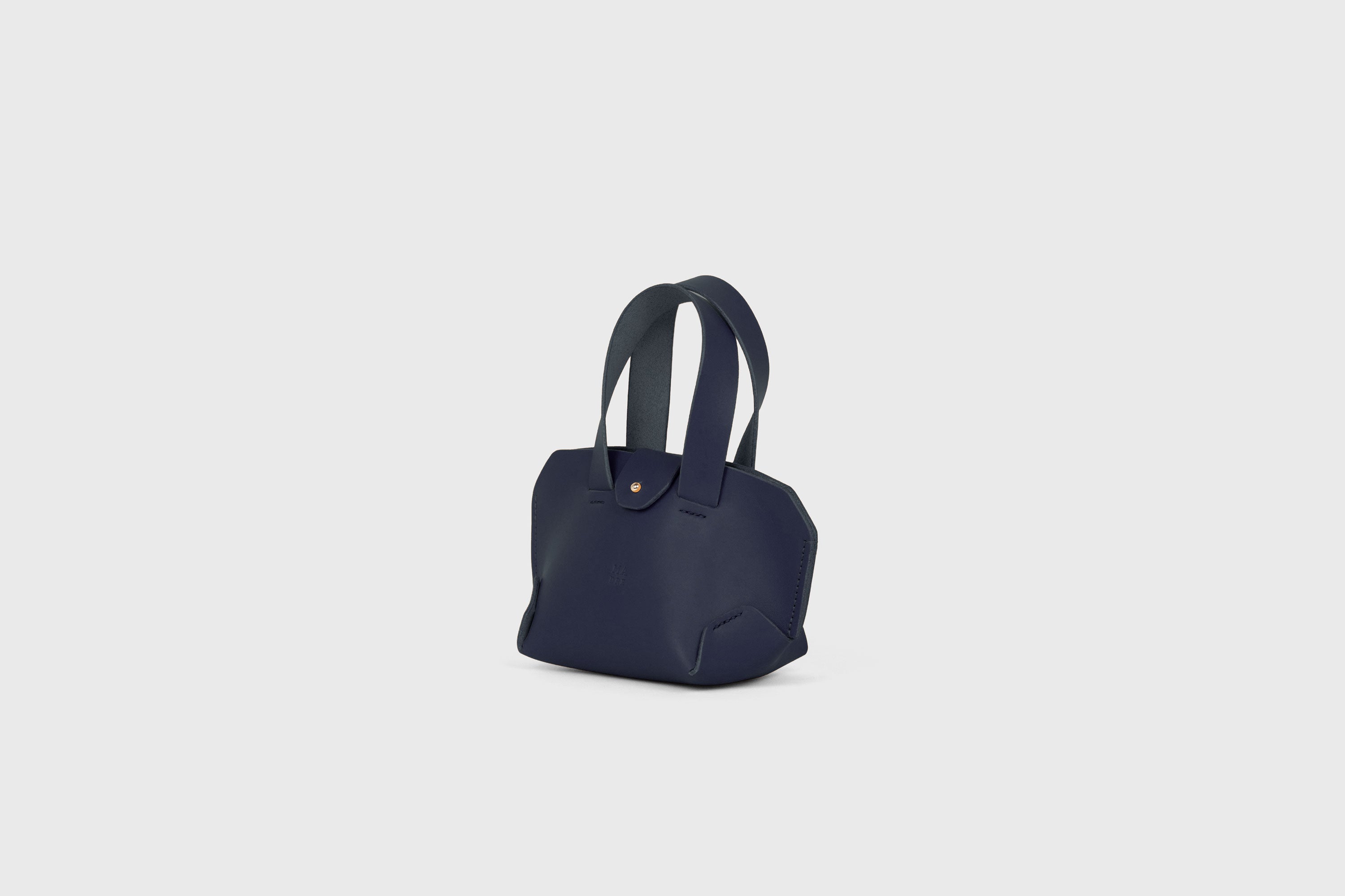 Nano Tote Bag In Marine Blue Color In Vegetable Tanned Leather Minimalistic Design Atelier Madre Manuel Dreesmann Barcelona Spain