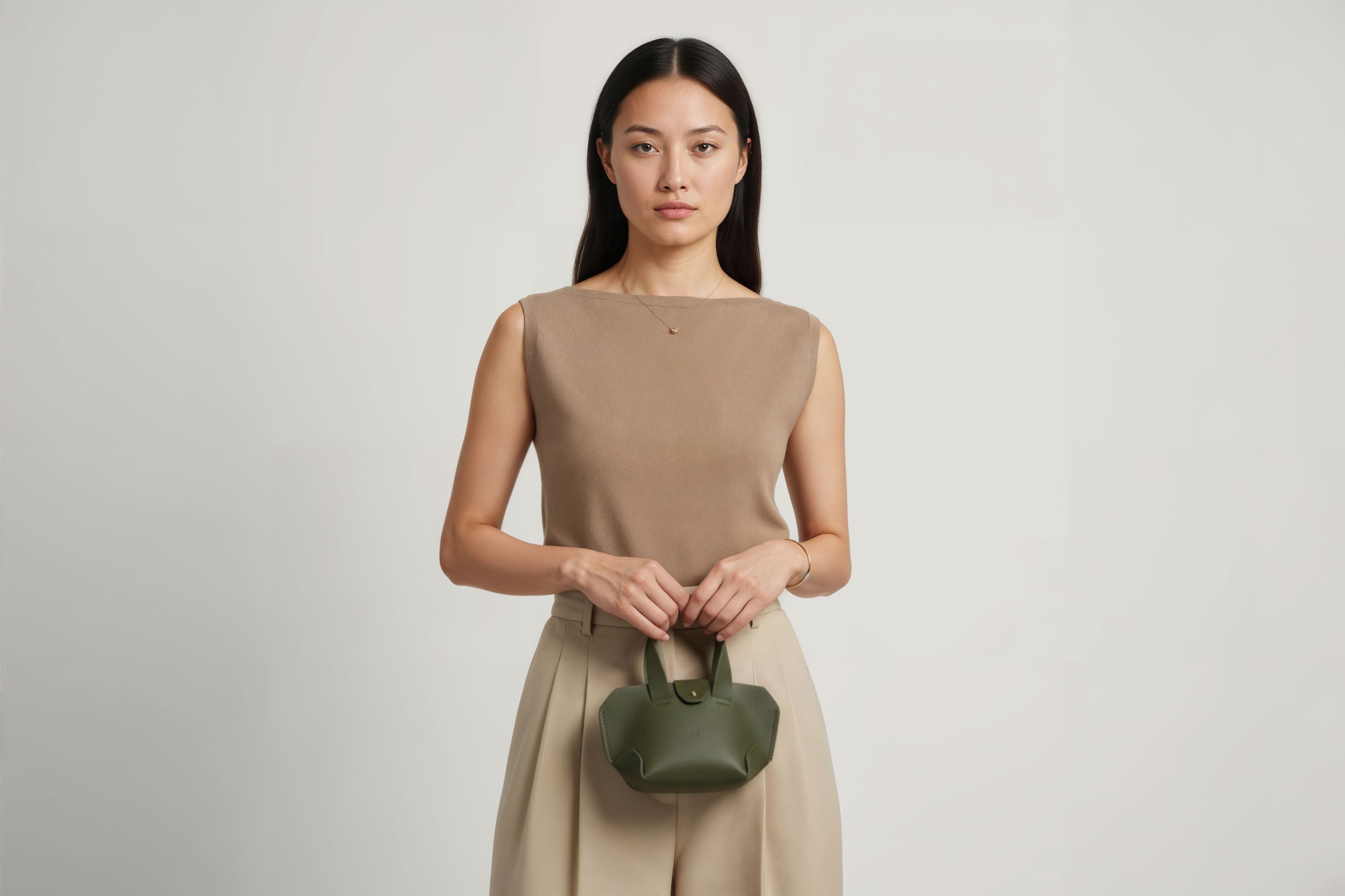 Nano Leather Tote Bag Olive Green Color On A Woman Model Premium Quality Minimalist Design Atelier Madre Manuel Dreesmann Barcelona Spain