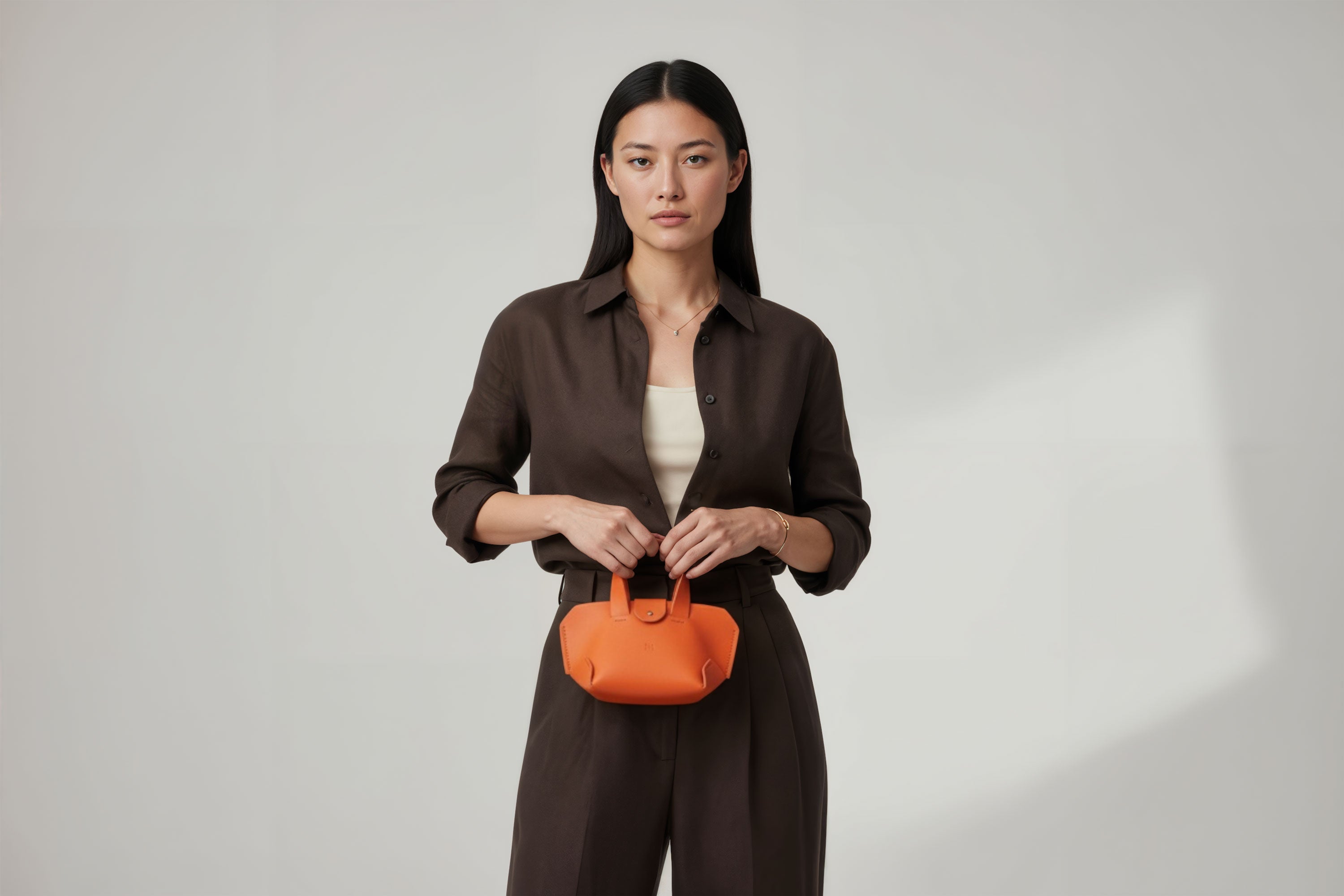 Nano Leather Tote Bag Orange Color On A Woman Model Premium Quality Minimalist Design Atelier Madre Manuel Dreesmann Barcelona Spain