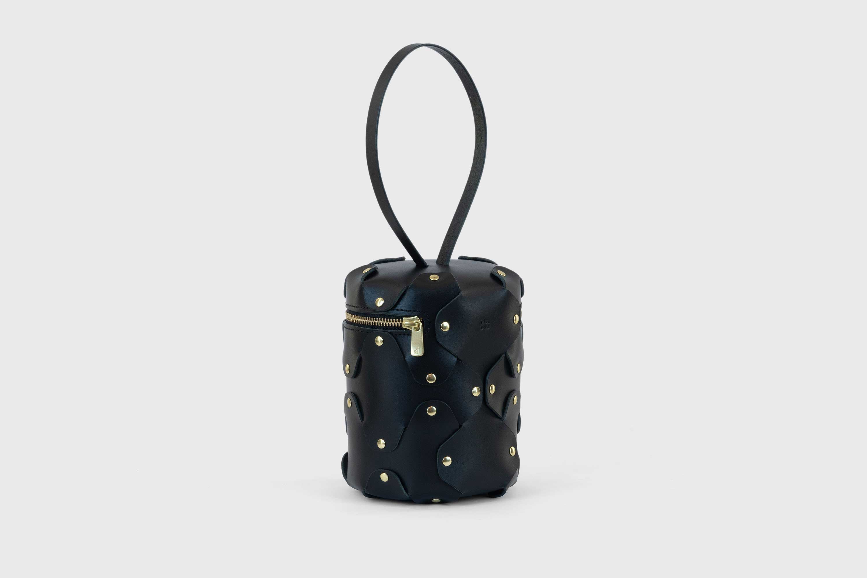 Nema Leather Bag Black Color Vegetable Tanned Full Grain Spain Brass Rivets Premium Design Minimalist Modern Cylinder Circle Round Zipper Pouch Handbag Clutch Bag Atelier Madre Manuel Dreesmann Barcelona