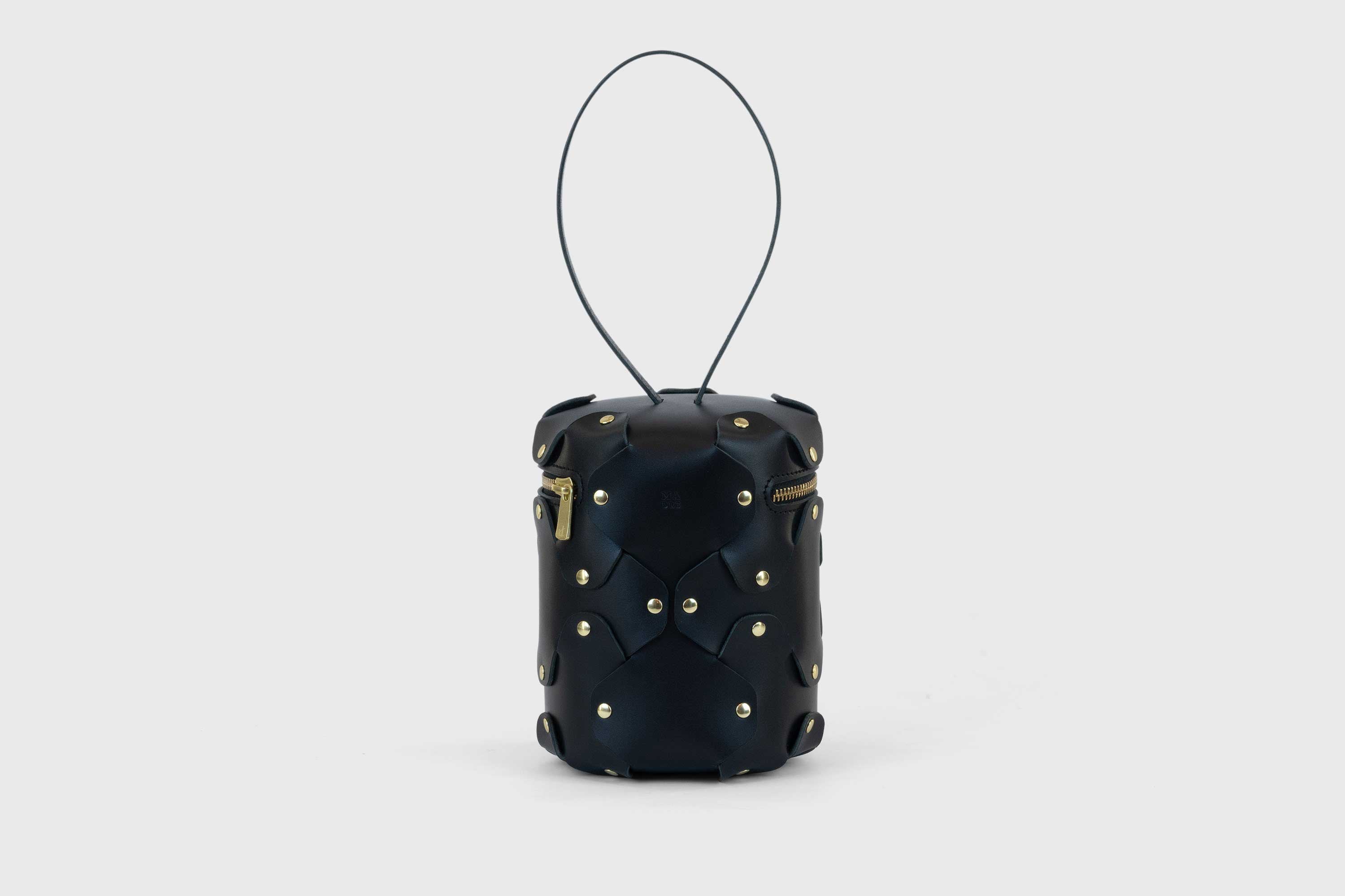 Nema Leather Bag Black Color Vegetable Tanned Full Grain Spain Brass Rivets Premium Design Minimalist Modern Cylinder Circle Round Zipper Pouch Handbag Clutch Bag Atelier Madre Manuel Dreesmann Barcelona