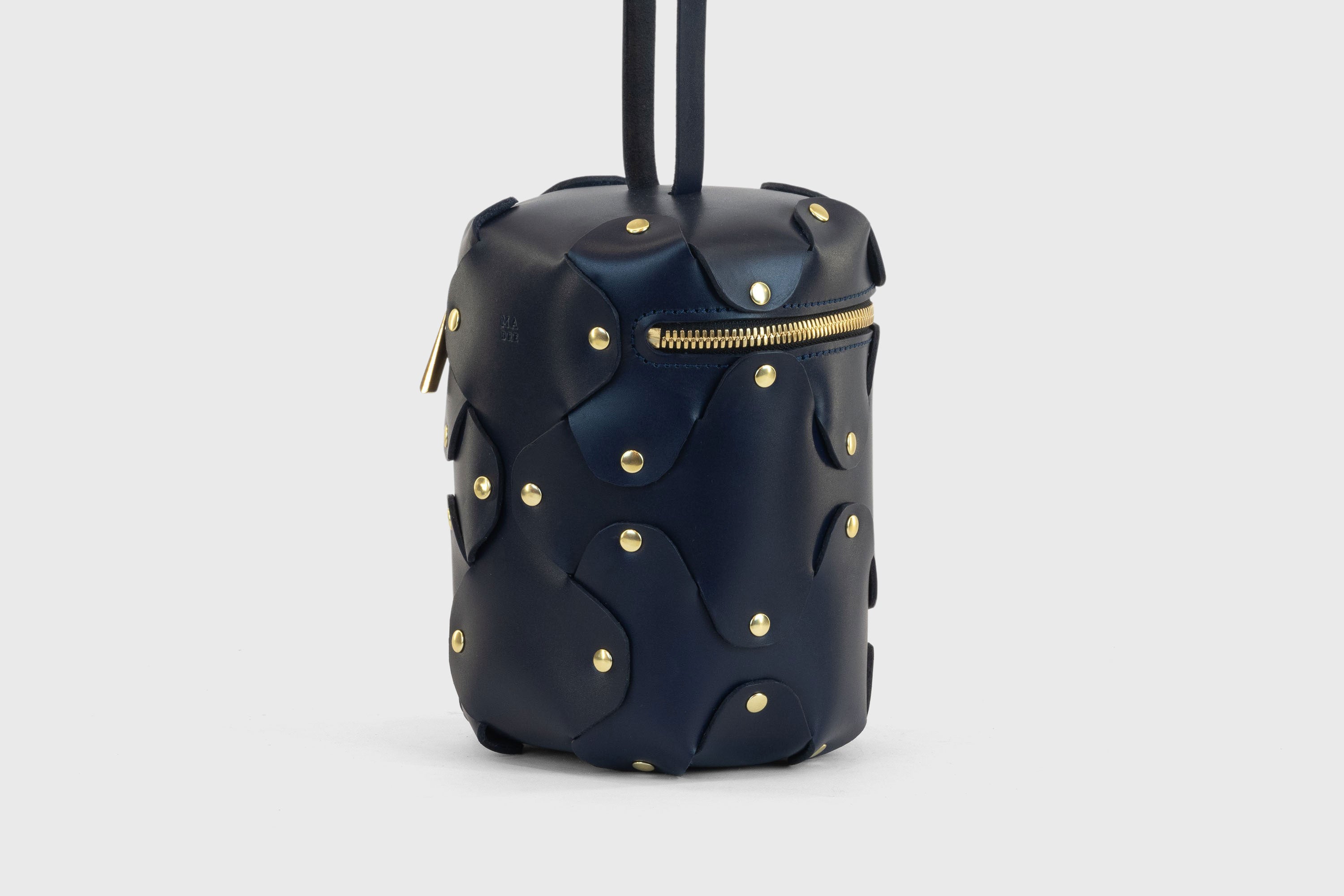 Nema Leather Bag Dark Marine Blue Color Vegetable Tanned Full Grain Spain Brass Rivets Premium Design Minimalist Modern Cylinder Circle Round Zipper Pouch Handbag Clutch Bag Atelier Madre Manuel Dreesmann Barcelona