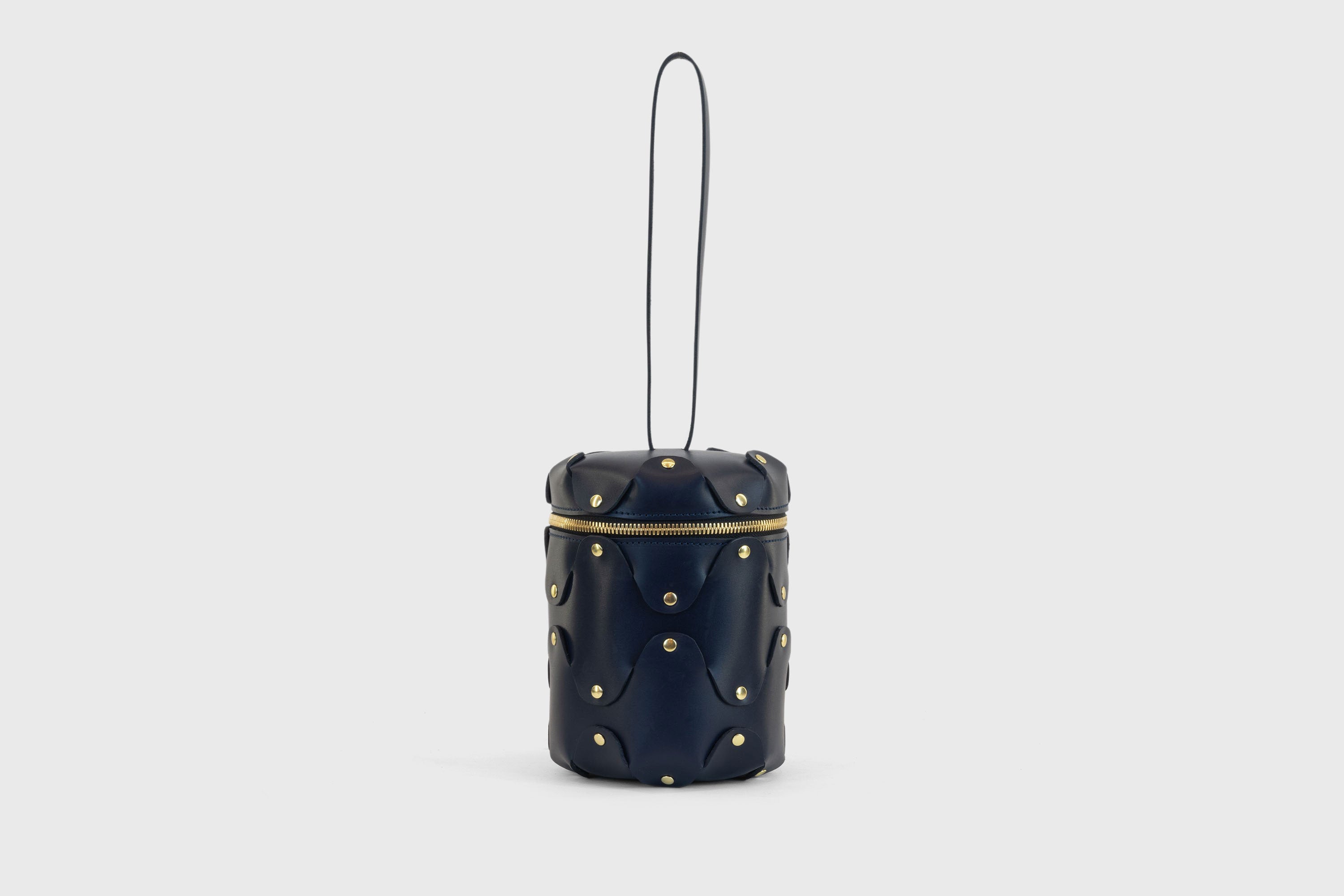 Nema Leather Bag Dark Marine Blue Color Vegetable Tanned Full Grain Spain Brass Rivets Premium Design Minimalist Modern Cylinder Circle Round Zipper Pouch Handbag Clutch Bag Atelier Madre Manuel Dreesmann Barcelona