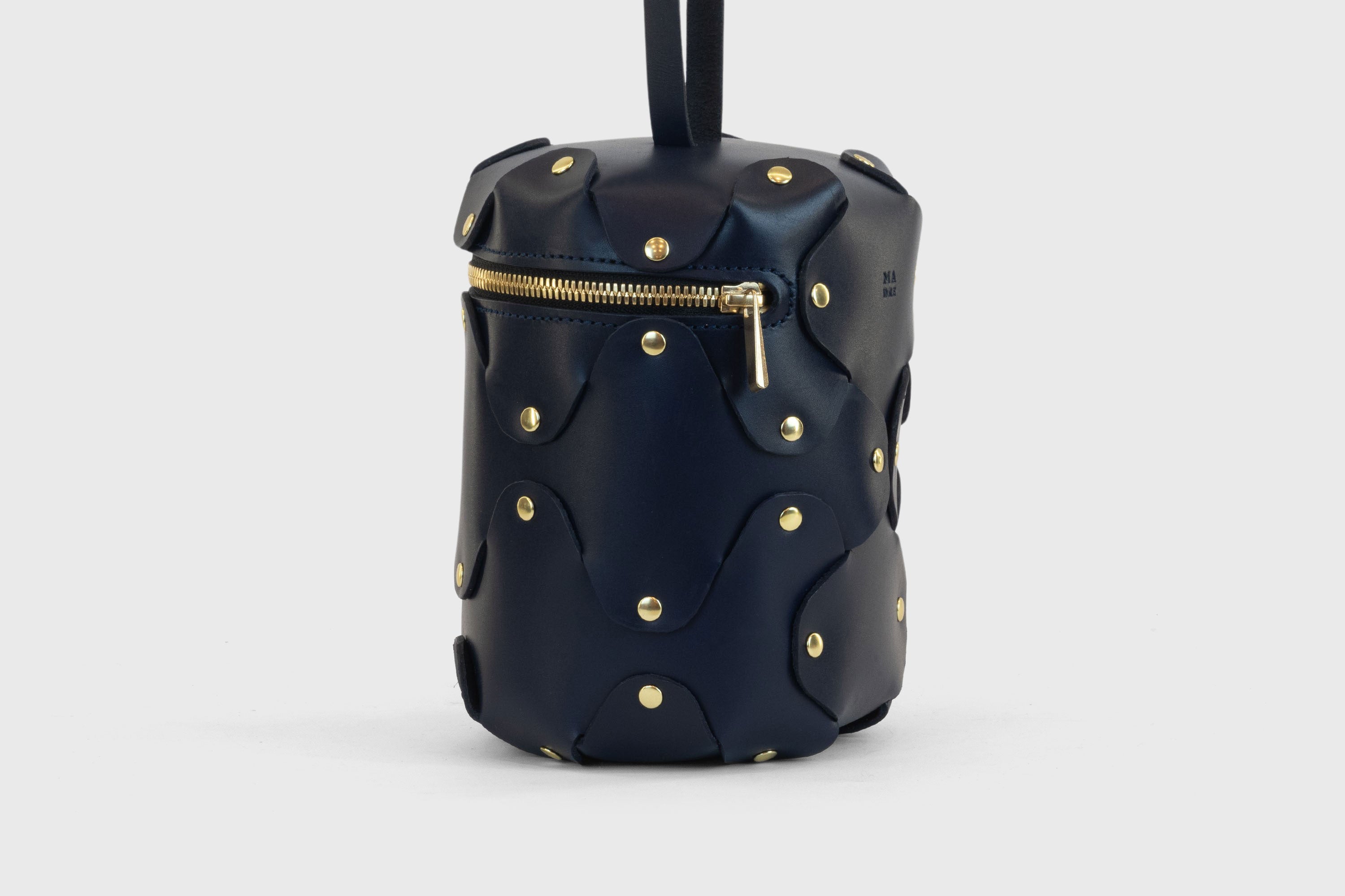 Nema Leather Bag Dark Marine Blue Color Vegetable Tanned Full Grain Spain Brass Rivets Premium Design Minimalist Modern Cylinder Circle Round Zipper Pouch Handbag Clutch Bag Atelier Madre Manuel Dreesmann Barcelona