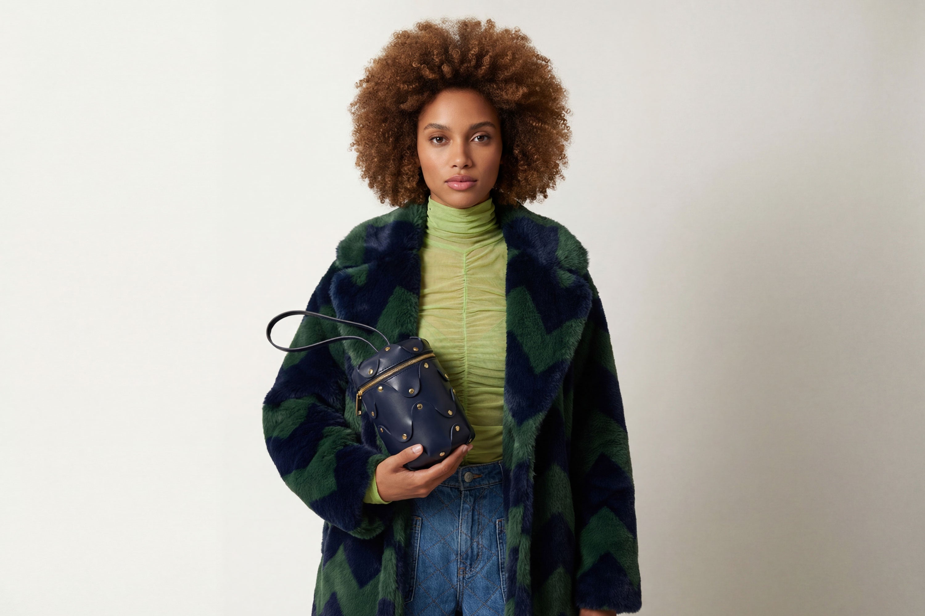 Nema Leather Bag Marine Blue Color On A Woman Model Vegetable Tanned Full Grain Spain Brass Rivets Premium Design Minimalist Modern Cylinder Circle Round Zipper Pouch Handbag Atelier Madre Manuel Dreesmann Barcelona