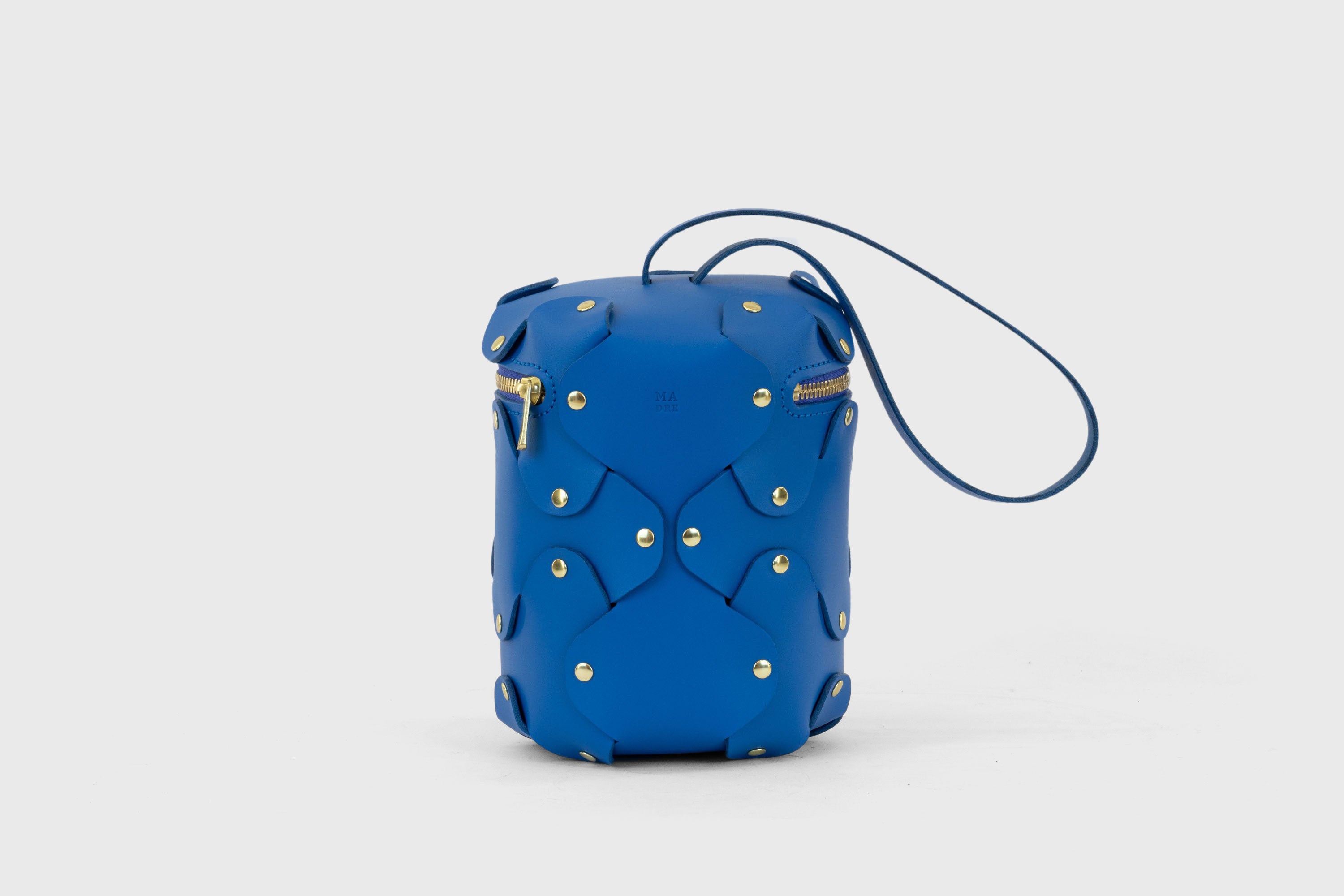 Nema Leather Bag Royal Blue Color Vegetable Tanned Full Grain Spain Brass Rivets Premium Design Minimalist Modern Cylinder Circle Round Zipper Pouch Handbag Clutch Bag Atelier Madre Manuel Dreesmann Barcelona