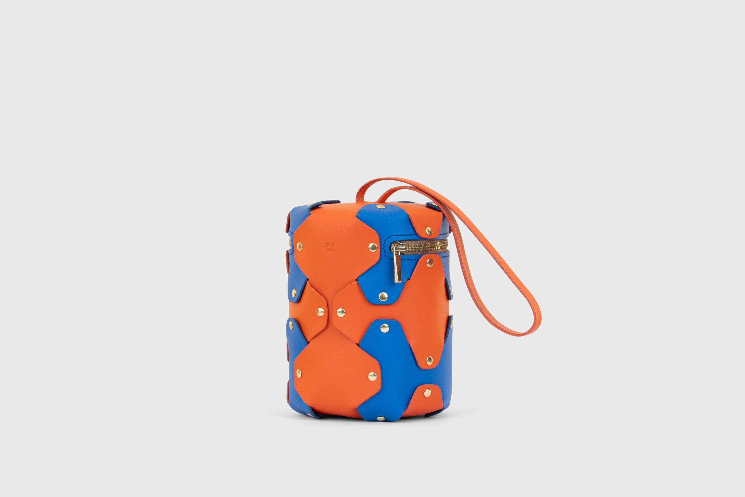 Nema Leather Bag Orange Royal Blue Vegetable Tanned Full Grain Spain Brass Rivets Premium Design Minimalist Modern Cylinder Circle Round Zipper Pouch Handbag Clutch Bag Atelier Madre Manuel Dreesmann Barcelona